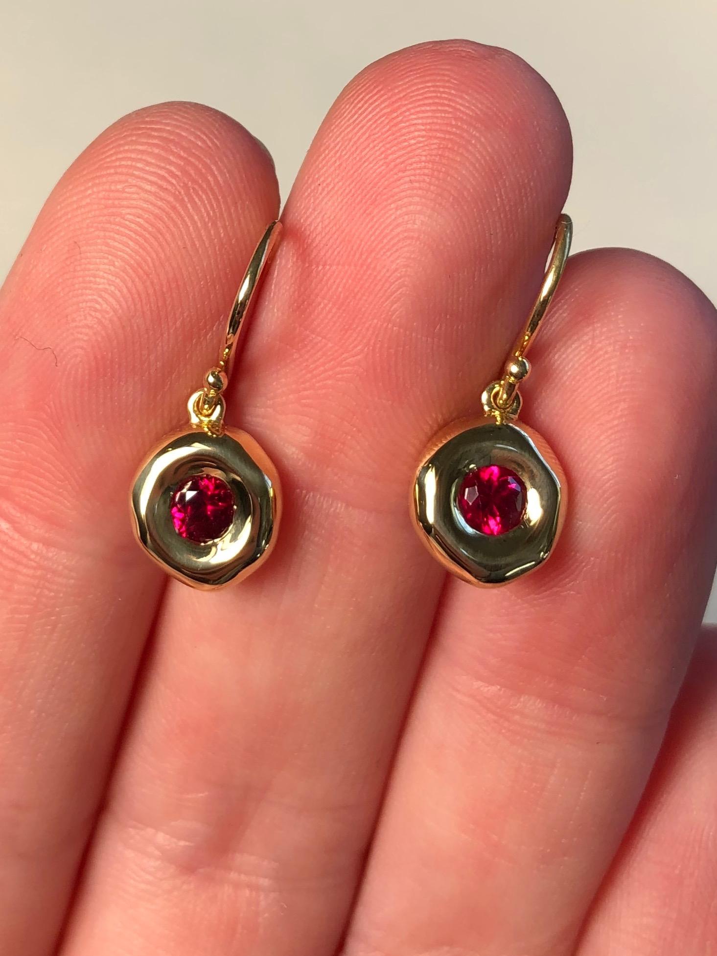 
Gemfields Mozambique rubies set in 18 karat solid gold bezel, on a french hook. $3,900.

Dimensions: 1.7 cm from top of french hook arch to bottom x 0.8 cm in width x 0.3 cm depth. 4 grams.

5 mm Gemfields Mozambique rubies

These earring were hand