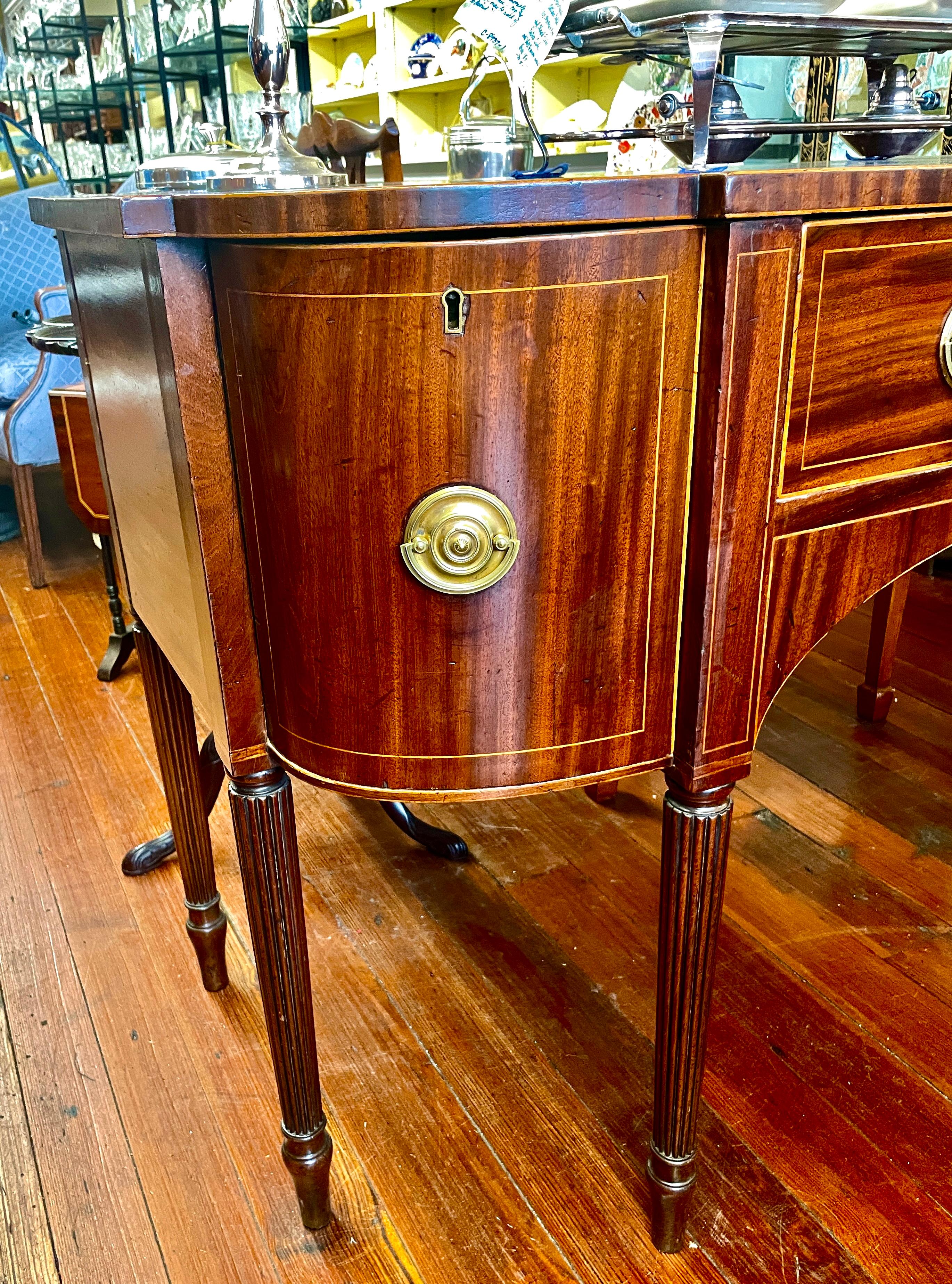 Hand-Carved Fine Geo. III English figured mahogany Hepplewhite style bowfront sideboard For Sale