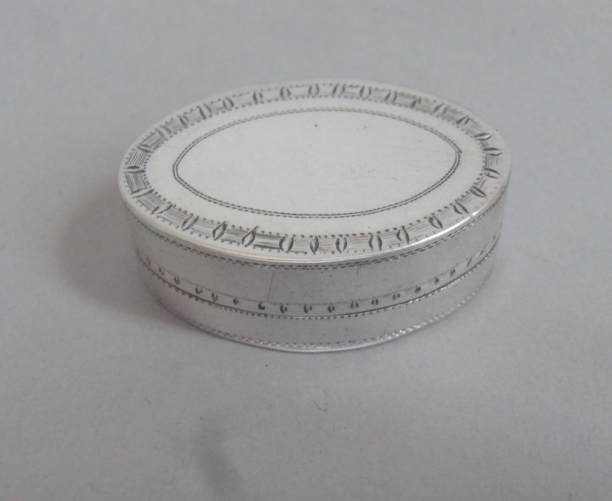A Fine George III Hinged Patch Box Made in London in 1799 by Thomas Brough,

The Box has an elliptical form and the hinged cover is engraved with an outer band of foliate motifs on a scratch engraved ground. The centre displays a set of contemporary