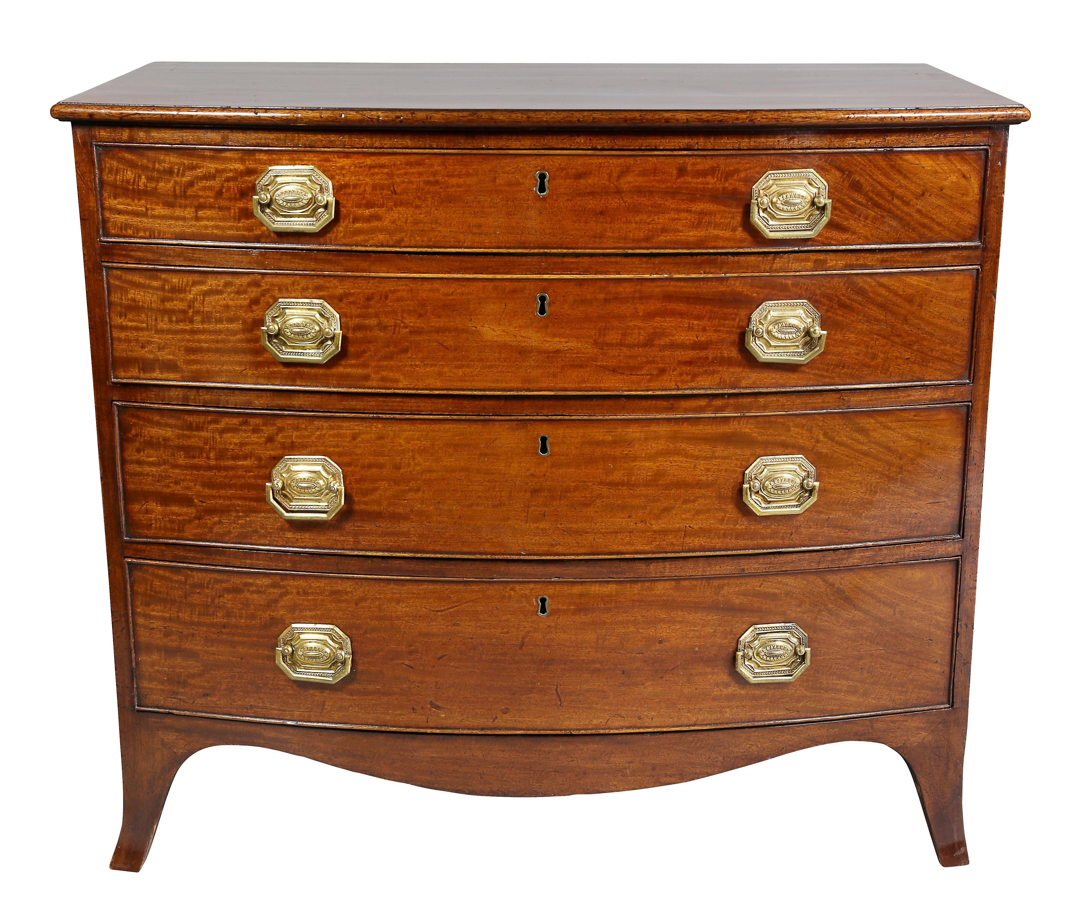 With bow front top over four graduated drawers with brass handles raised on splayed legs.