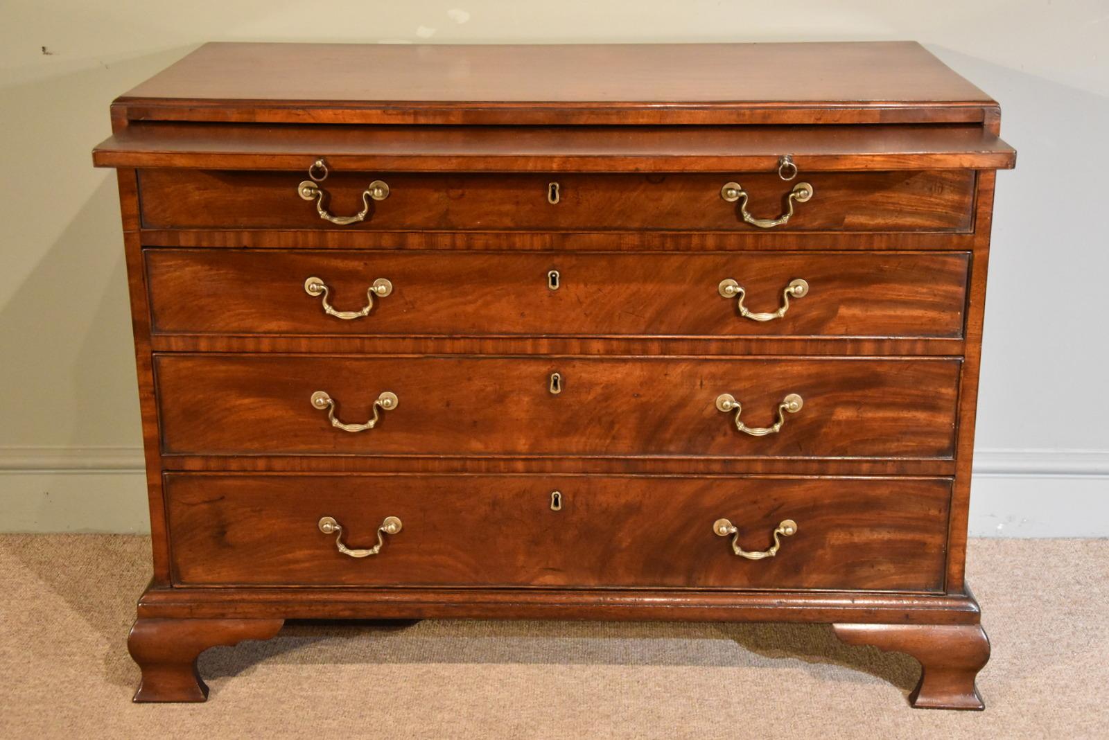 Fine George III mahogany graduated chest of drawers with brushing slide of commode proportions with original brasses and later feet.

Dimensions:
height 31” (79cm)
width 41