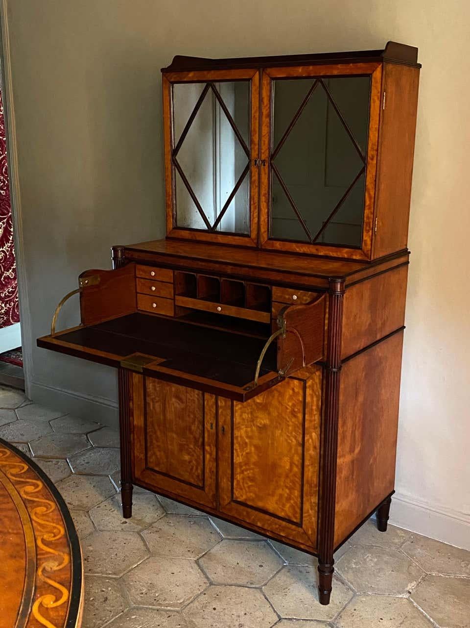 An exceptional English Sheraton period satinwood secretaire cabinet. Attributed to Gillows.

Late-18th century, George III, ca 1790.

Measures:
H 59 1/2’’ (151 cm)
W 30’’ (76 cm)
D 19’’ (49 cm).

This small, beautifully-proportioned, and