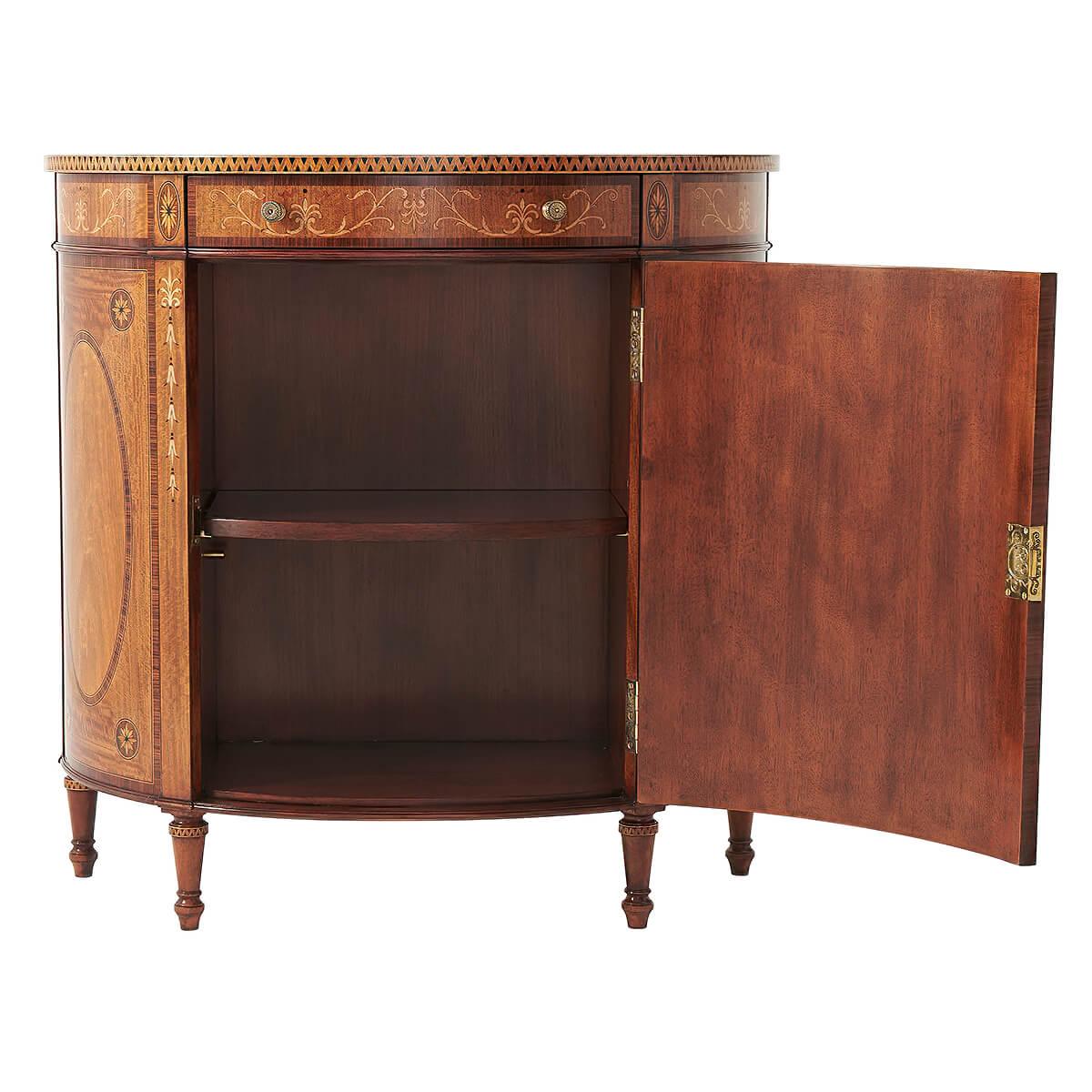 A fine satinwood, rosewood banded and sycamore marquetry inlaid demilune side cabinet, the fine leaf and fan inlaid top above an anthemion and honeysuckle inlaid frieze with a drawer, above a classical yew burl inlaid urn and oval walnut banded