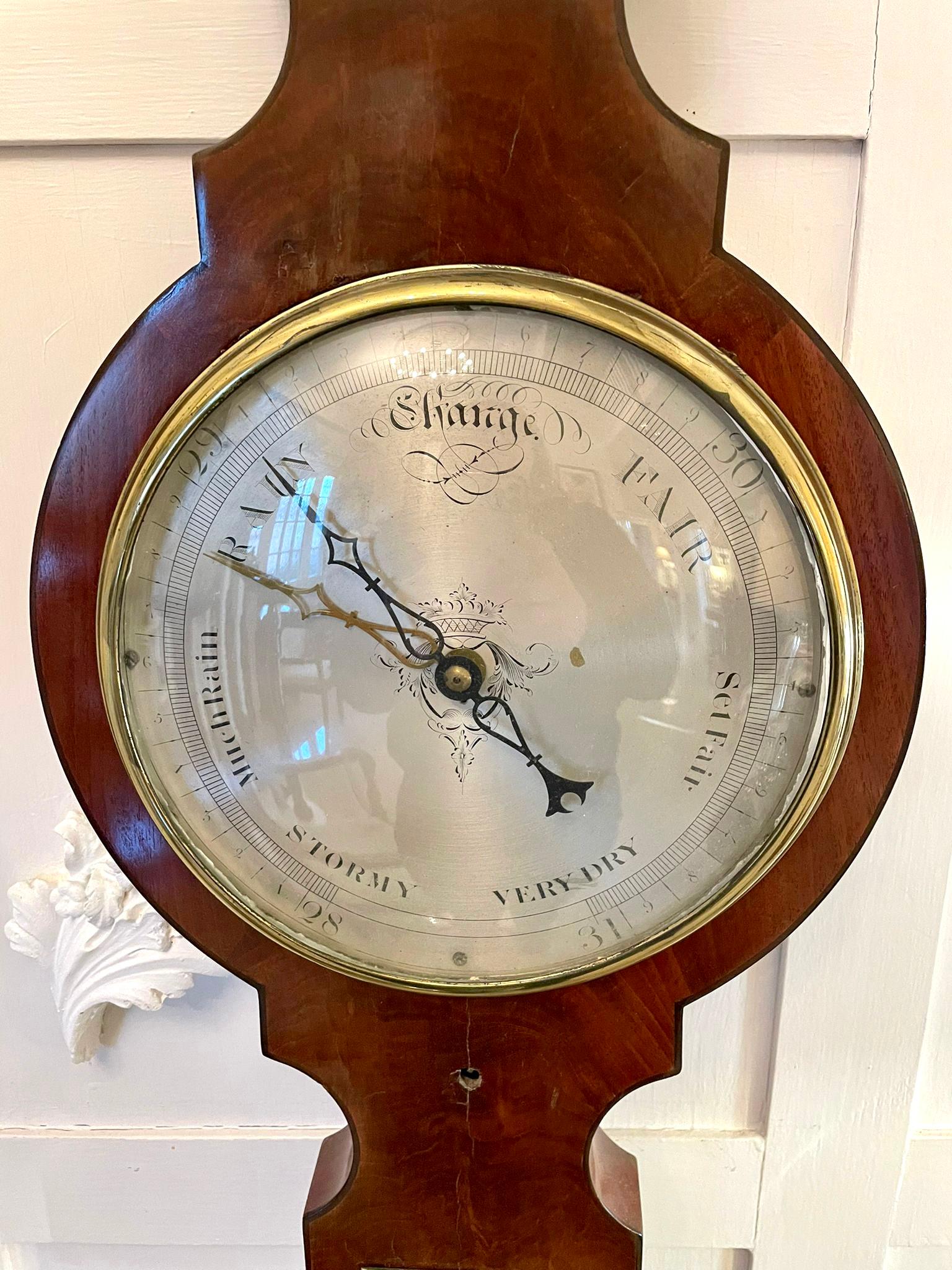 Fine George III quality mahogany banjo barometer having a swan neck pediment with original brass finial, quality shaped mahogany case with a thermometer, hygrometer, spirit level and a circular silvered engraved dial with original hands and brass