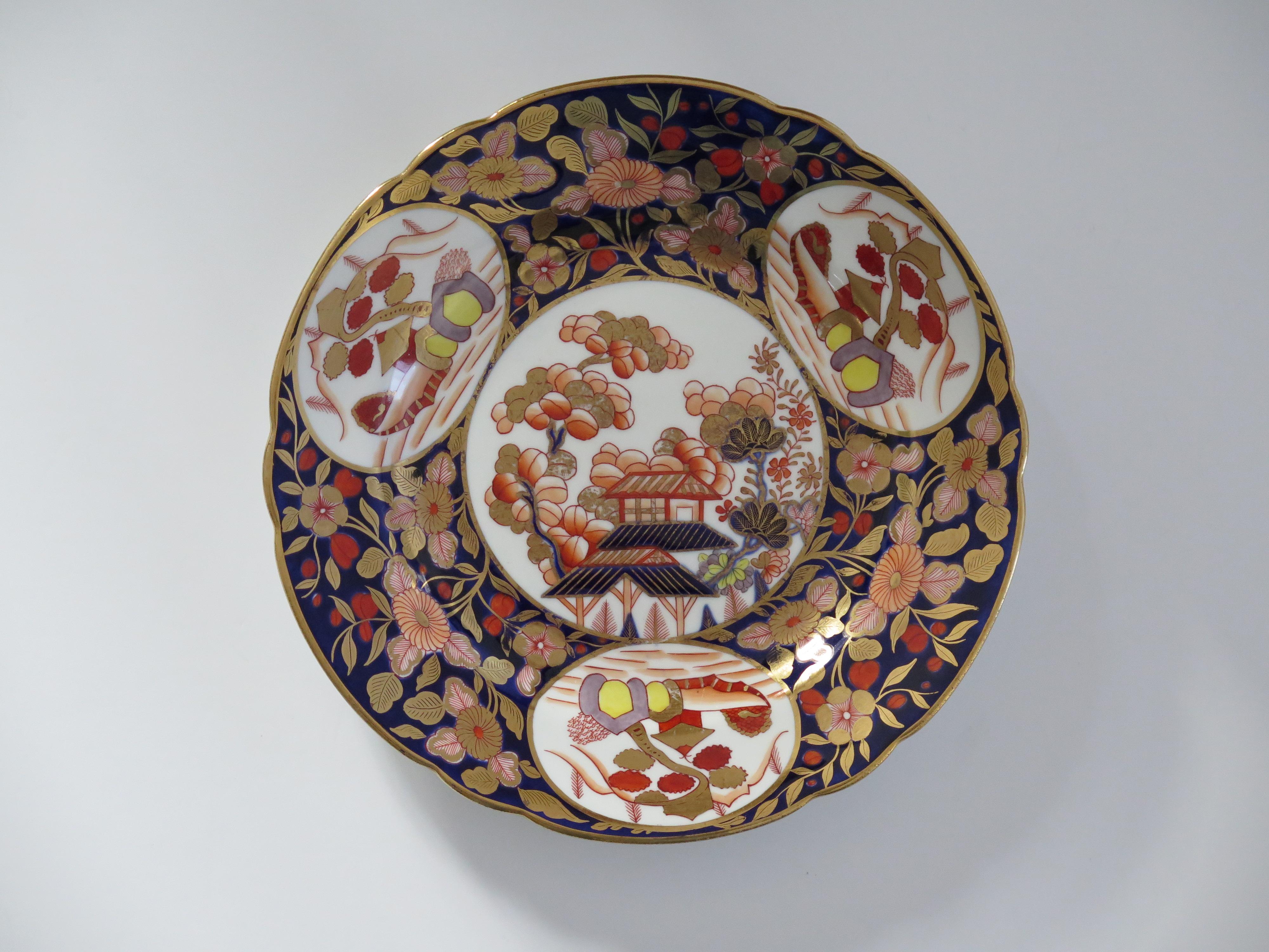 This is a fine example of an English George III period, Coalport Desert Plate, hand painted in pattern 1949 and dating from the early 19th century, circa 1810.

The Plate is well potted on a low foot with a wavy rim. 

It is beautifully hand