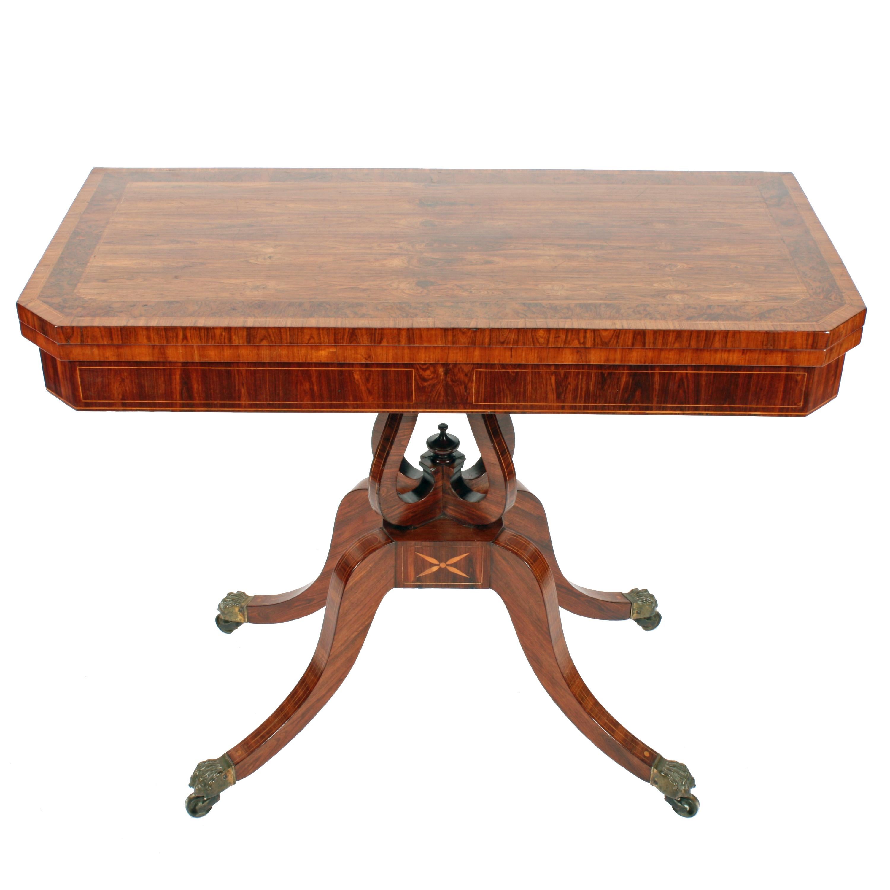 Fine Georgian kingwood card table.


A fine quality Georgian kingwood veneered turn over top card table.

The tabletop has a broad burr yew wood crossbanding with a cross grain kingwood crossbanded edge and kingwood line inlays.

The table stands on