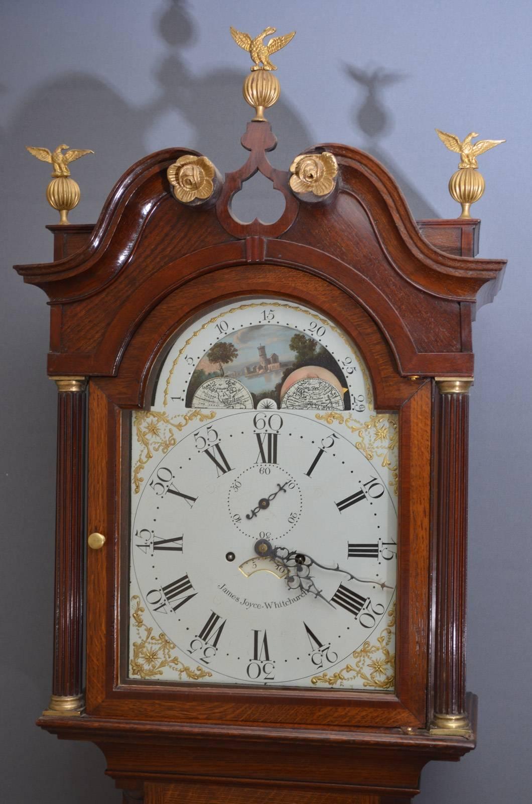 Sn3363, fine quality, George III grandfather clock in oak, having painted dial with Roman and Arabic numerals, floral spandrels and moon phase, subsidiary dial to centre and 8-day movement striking on the bell, signed by James Joyce, Whitchurch all