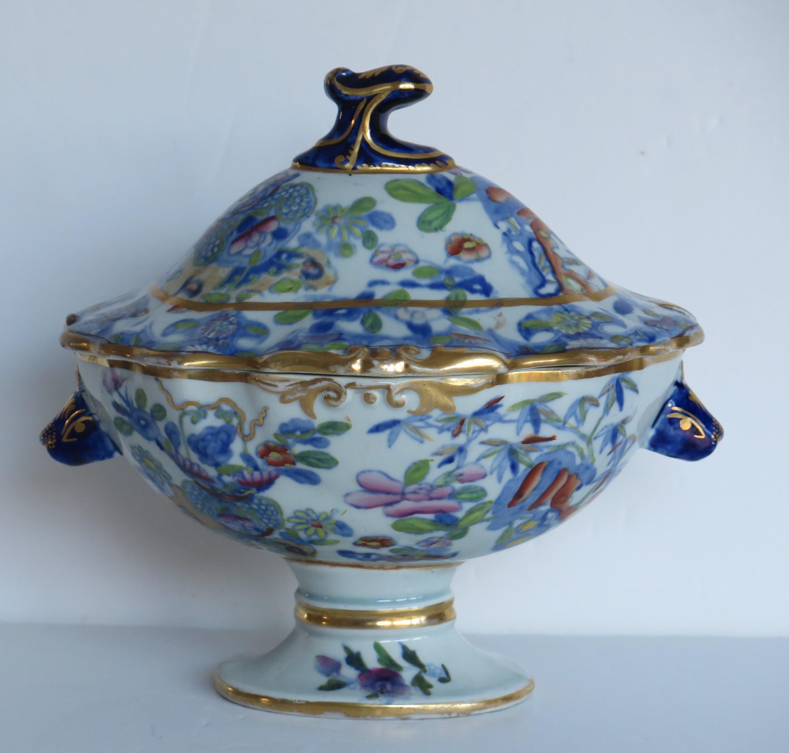 This is a superb Ironstone Sauce Tureen, complete with lid, made by Mason's of Lane Delph, Staffordshire, England, during the early part of the 19th century, circa 1820.

This tureen and its lid are well potted in a beautiful and elegant pedestal