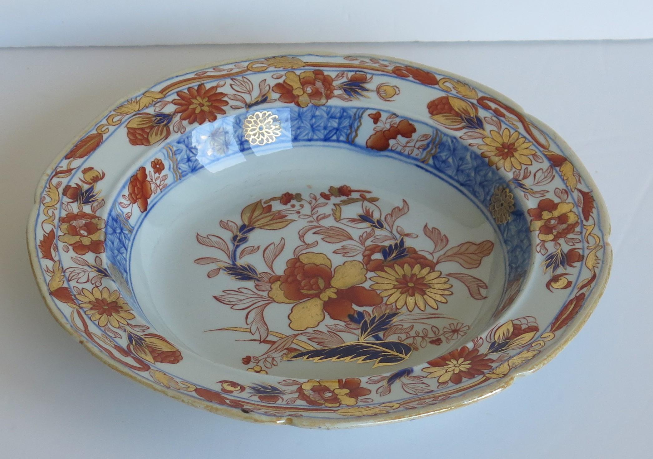 This is a fine Ironstone pottery soup bowl or deep plate made by the Mason's factory at Lane Delph, Staffordshire, England and beautifully decorated in the Gold Chrysanthemum Pattern, fully stamped and dating to the earliest period of Mason's