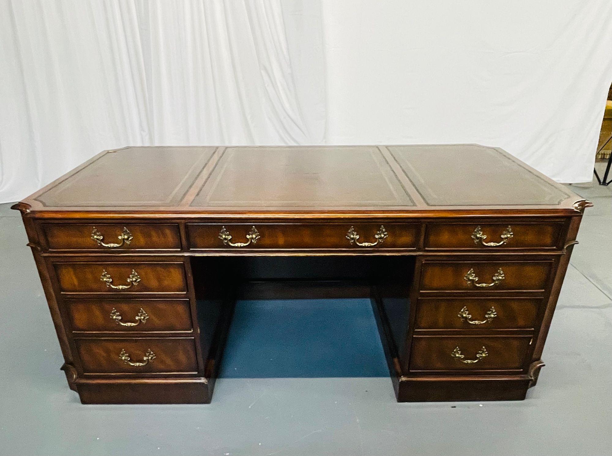 A Georgian style flame mahogany partners desk, tooled leather top, 
 
A Georgian Style Partners Desk, possibly Baker, having full drawers with a file cabinet on one side, the opposite side with a center drawer and two flanking drawers with shelved