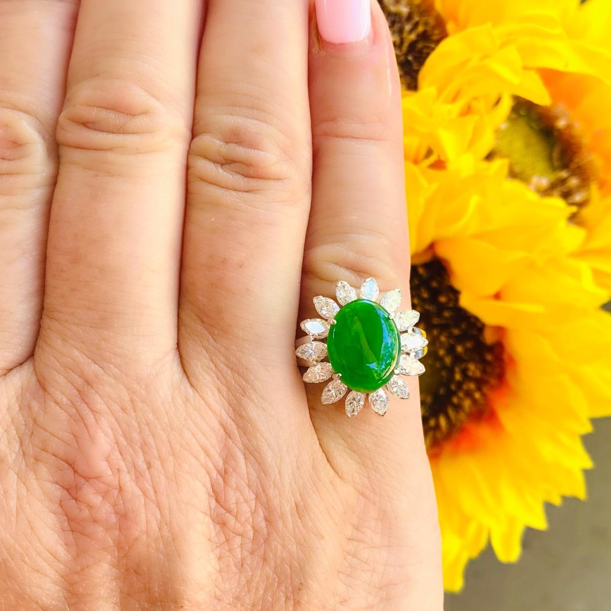For the discriminating collector who appreciates and understands fine jade. This estate platinum ring centers on a gorgeous piece of fine oval jade graded by the Gemological Institute of America as Type A Natural Jadeite Jade with no indications of
