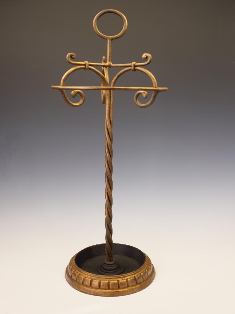 Fine Gilded Hand-Forged Wrought Iron Stick or Umbrella Stand
French, Circa 1900
A superb and highly decorative hand-forged wrought iron stick or umbrella stand, retaining its original gilded surface and rich, time-worn patina. The craftsmanship is