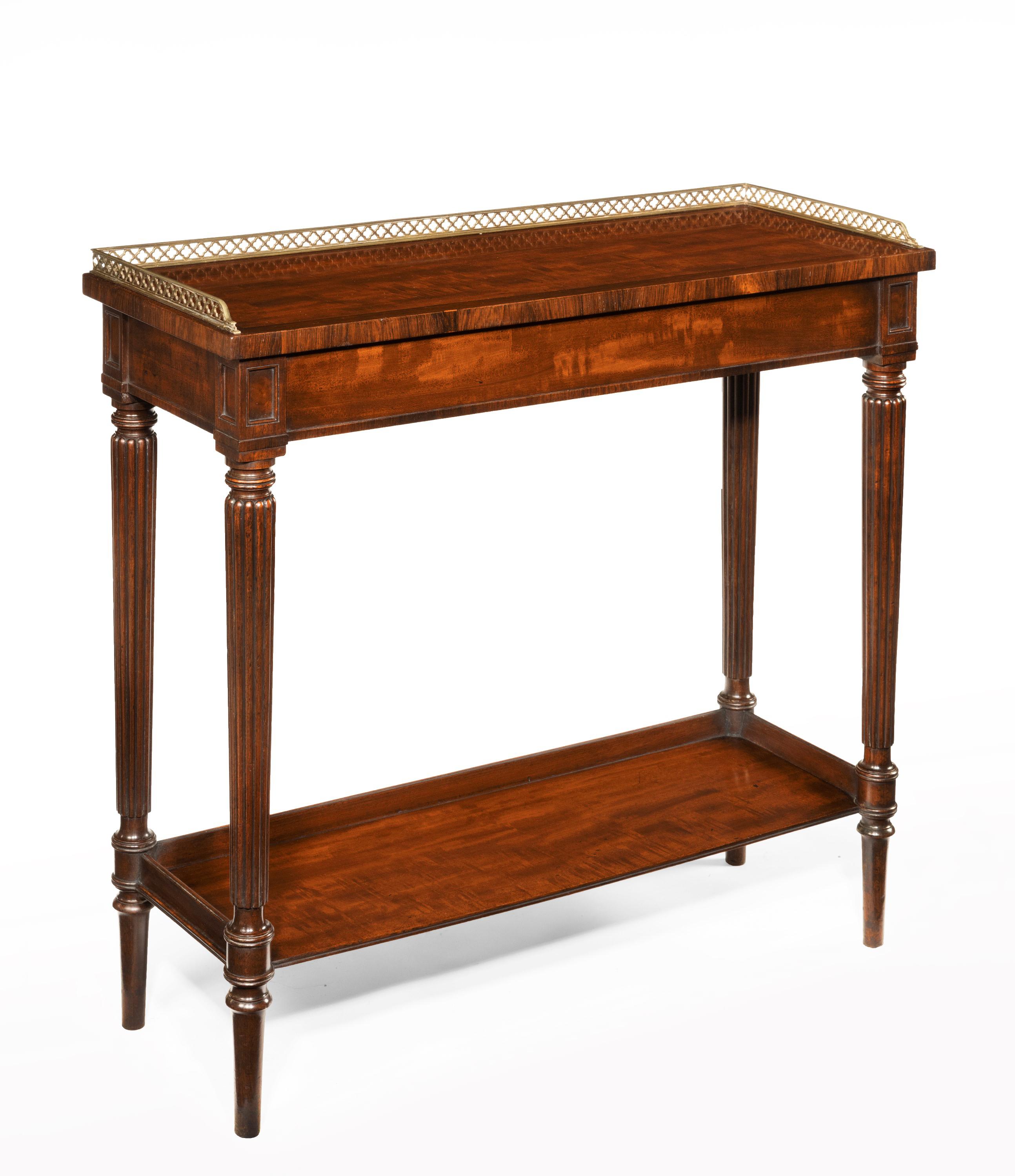 A fine quality late Regency mahogany hall console side table attributed to Gillows.

English, circa 1825.

The rectangular mahogany top, banded in rosewood with a pierced brass three quarter gallery above a lipped frieze on finely reeded