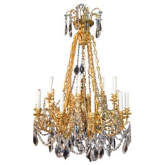 Lampadario in bronzo dorato e cristallo