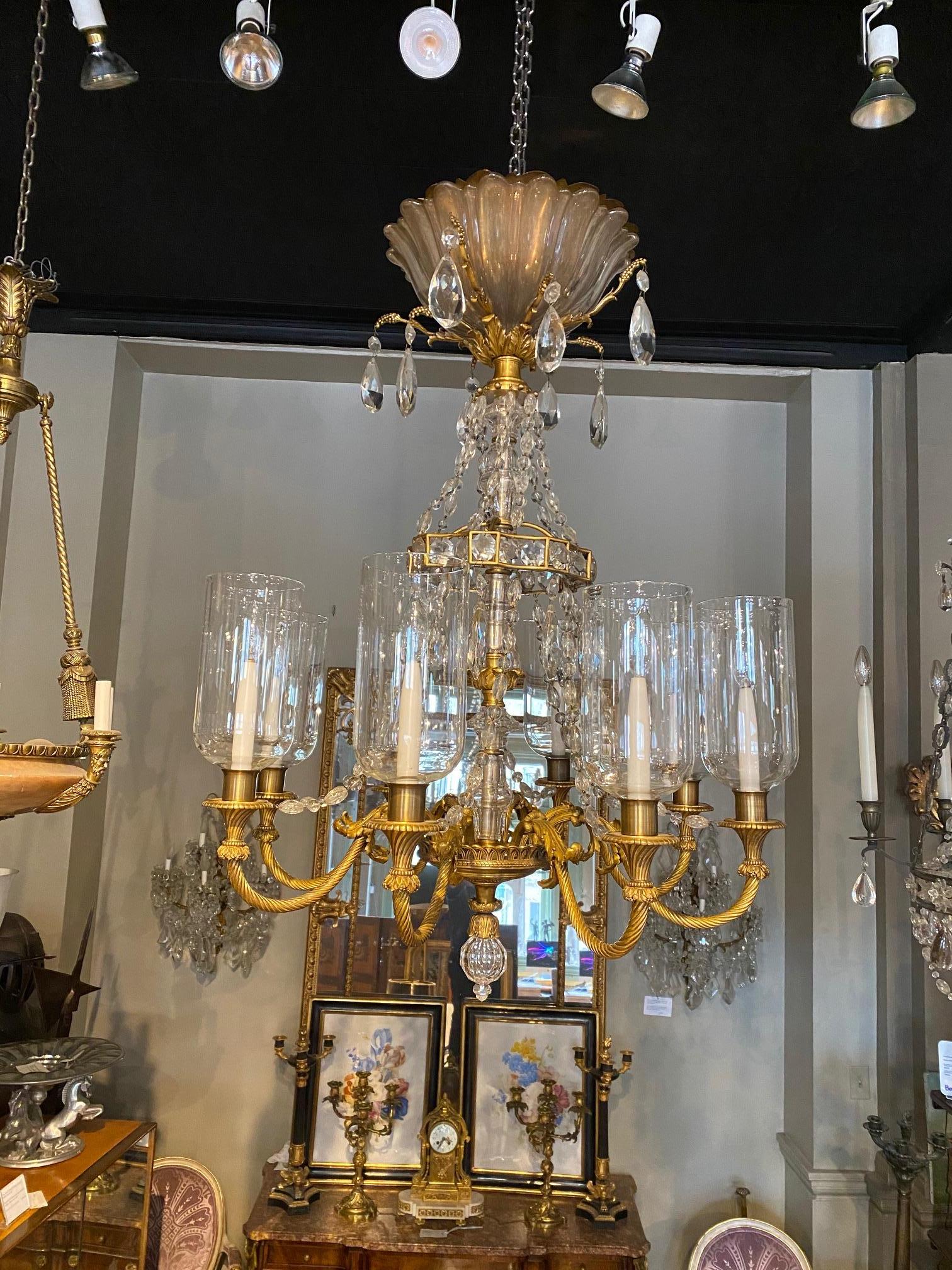 Very fine Louis XVI style gilt bronze and crystal  8 light chandelier by Maison Baguès.
The  cast bronze structure is  gilt with a soft matt gilding and finely chased, featuring acanthus, grappes and wine leaves, each light is fitted with a glass
