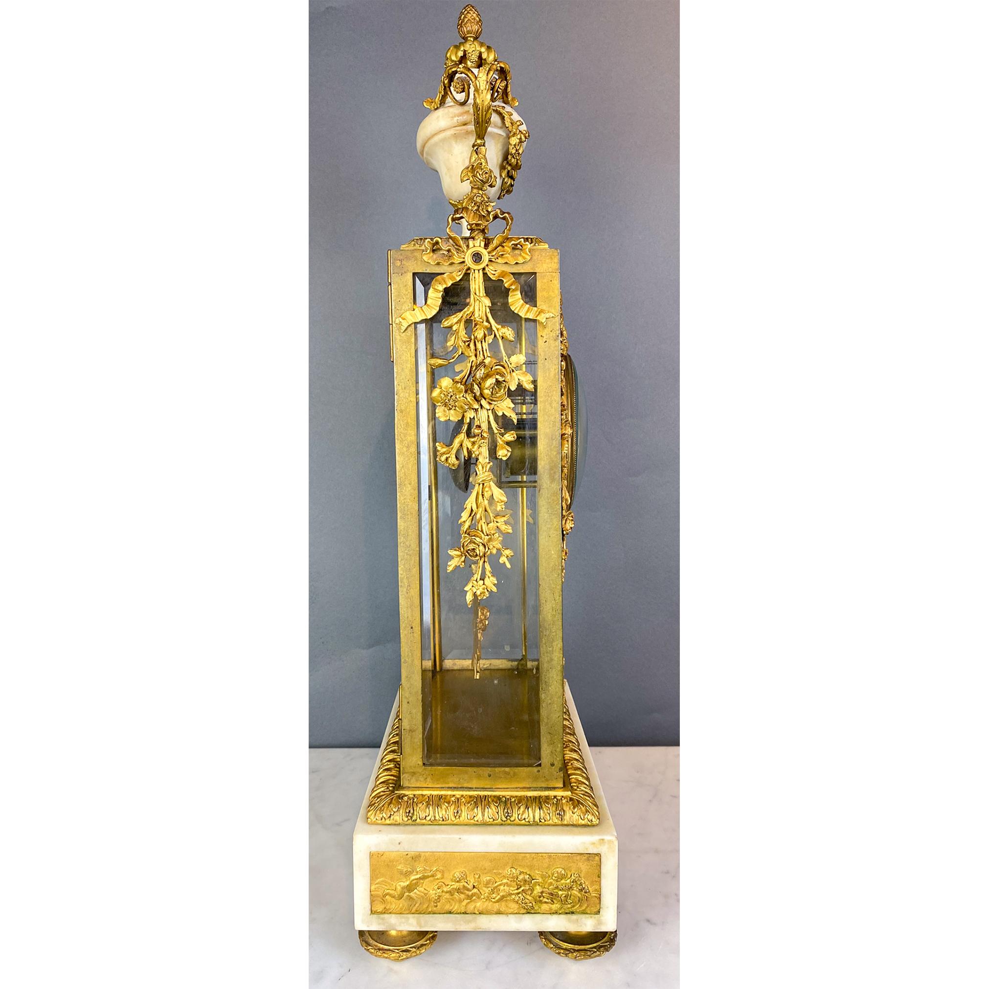 Fine Gilt Bronze and Glass Clock with Sun Pendulum, Floral and Urn Details In Good Condition For Sale In New York, NY