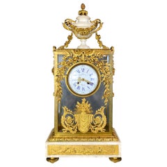 Fine Gilt Bronze and Glass Clock with Sun Pendulum, Floral and Urn Details