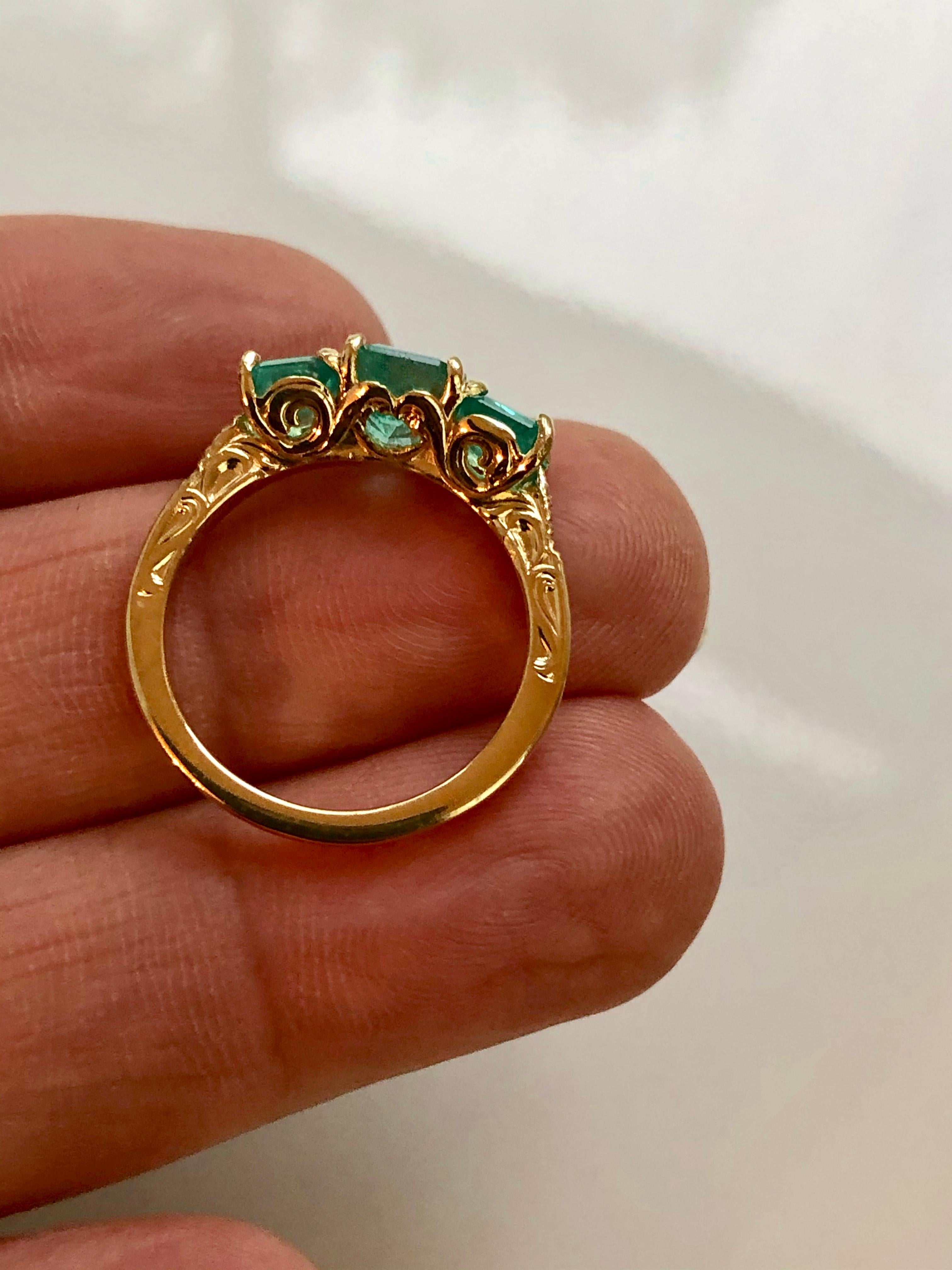 three stone emerald ring