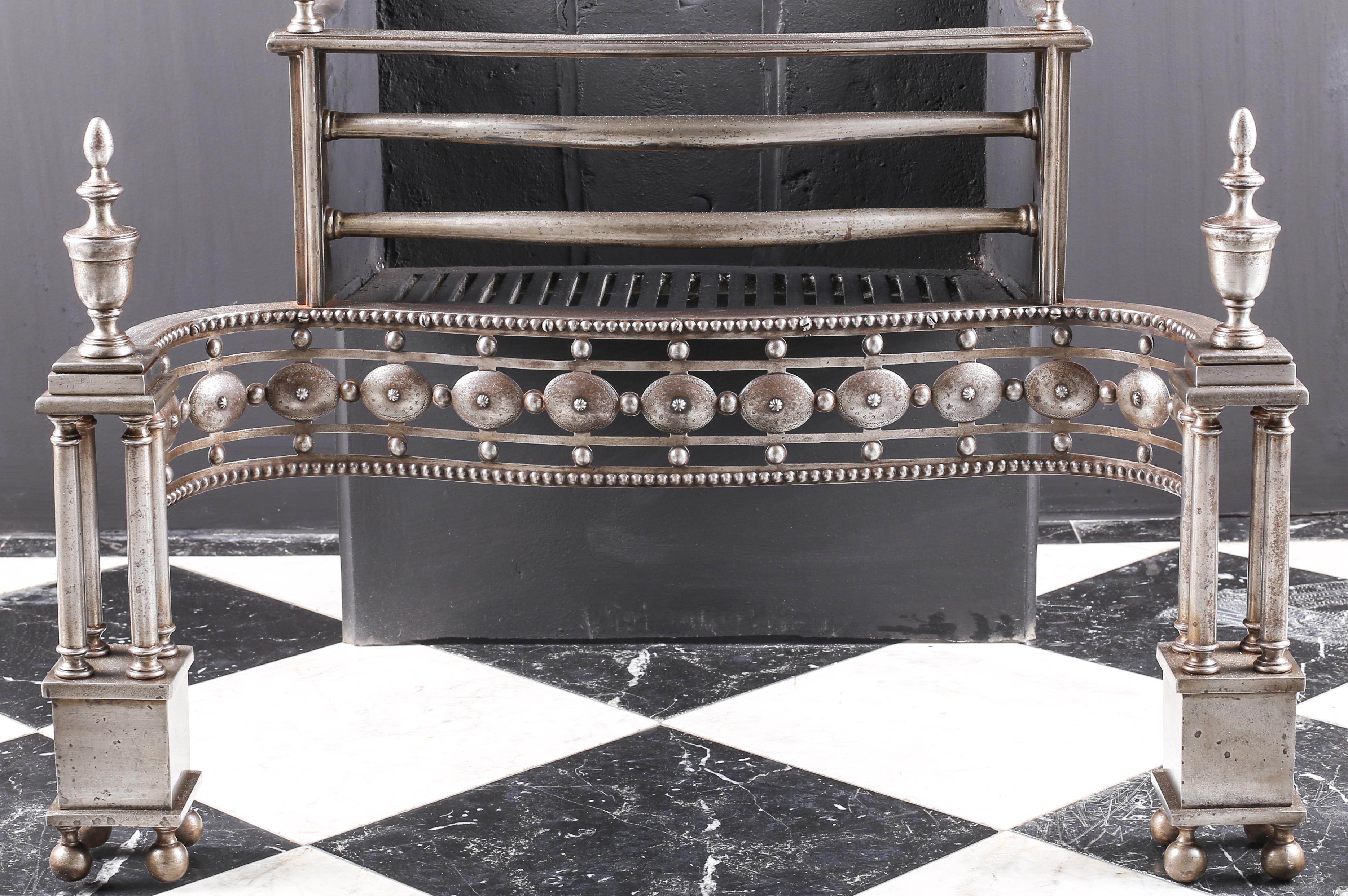 A fine and grand Georgian style steel and cast iron engraved antique fire basket, English, circa 1870.

Measures: Depth 19