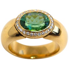 Ring in Rose Gold with 1 Green Tourmaline and Diamonds.