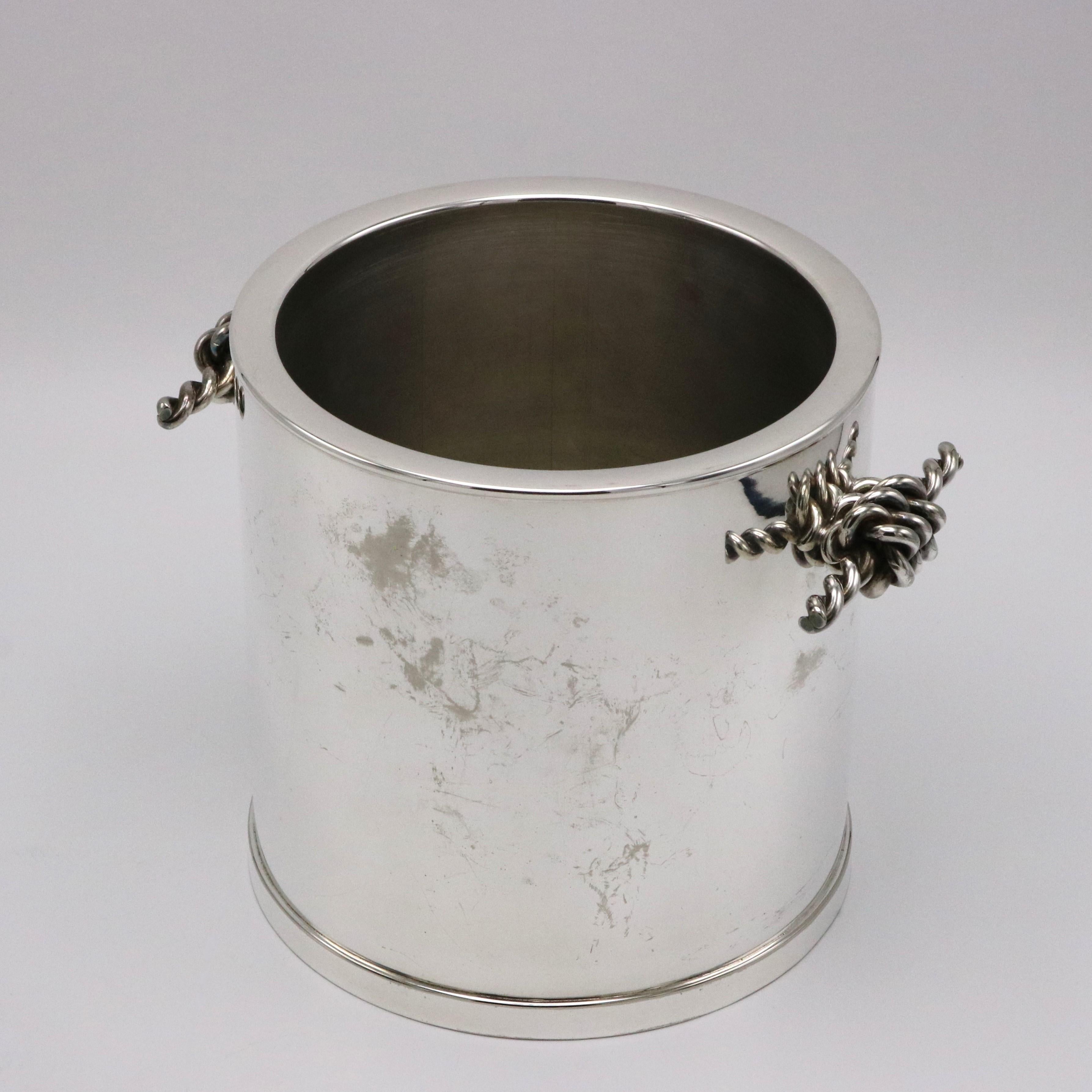 A fine Gucci designed silver plated ice bucket with braided handle details.