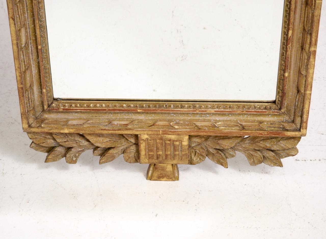 Fine Gustavian mirror, scraped to original guilt, 19th century
Measures: H. 128 W. 56 D. 3 cm 
H. 50.3 W. 22 D. 1.1 in.