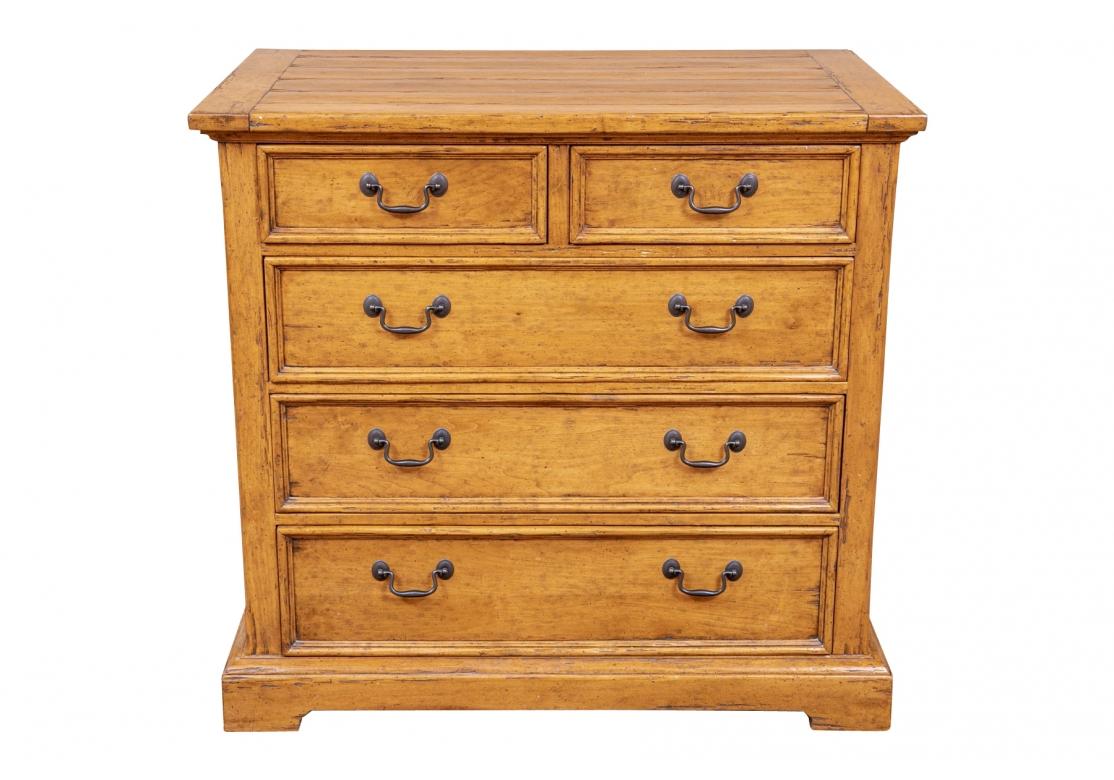 A very well made Two-Over-Three Chest attributed Guy Chaddock, known as an American maker of fine quality furniture. Five drawers, with molding along the front of each drawer. Warm light honey finish with heavy distressing and a planked top. 