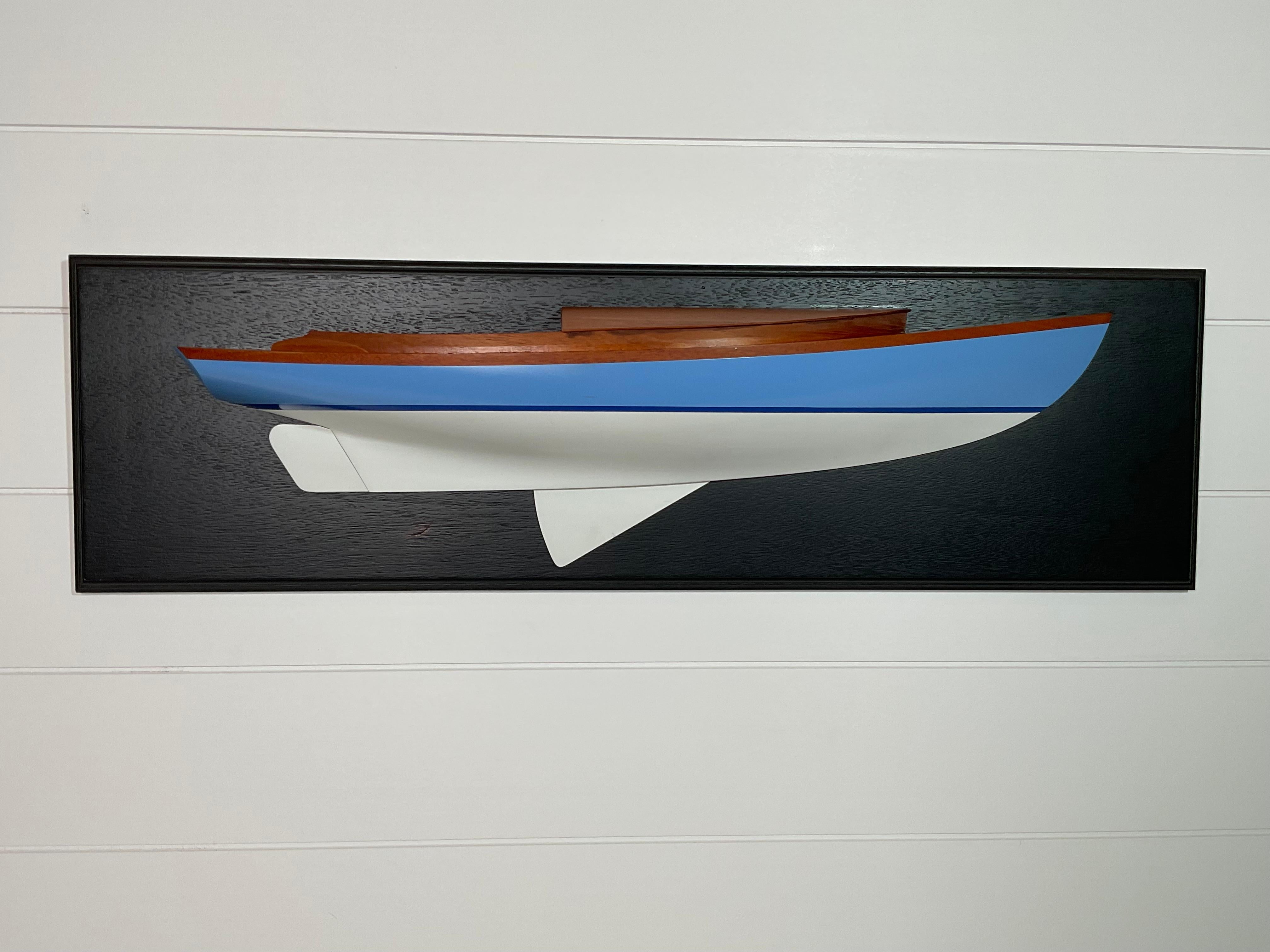 Carved half model by Marsom Pratt Jr. of a Herreshoff Design 907, a 30 foot drop centerboard sloop with long mahogany trunk cabin and sunken cockpit. Exceptional craftsmanship.

Weight:    5 lbs.
Overall Dimensions:    8