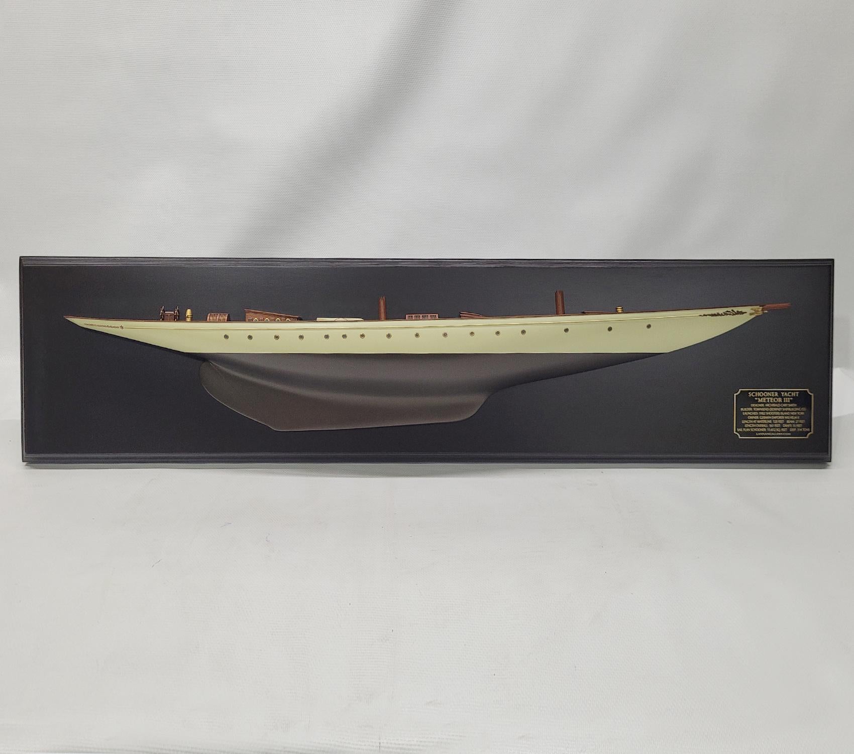 This model has exceptional deck detail with cabin, Many detailed skylights with brass bars, cabin, with brass porthole, deck fittings, stubbed masts, binnacle, helm, etc. The Hull is painted white over bronze and is fitted with a row of turned brass
