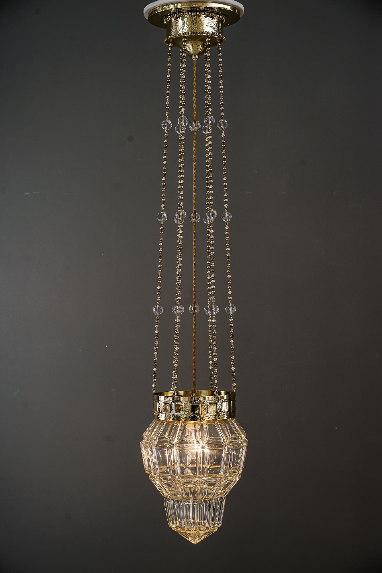 Brass Fine Hammered Pendant with a High Quality Glass Shade Vienna Around 1920s For Sale