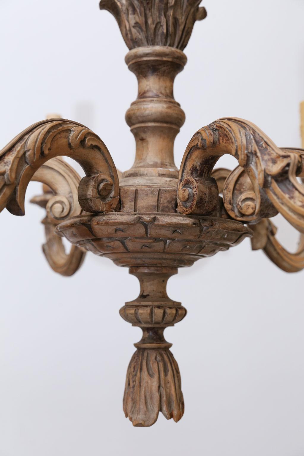 Fine hand carved Italian chandelier (circa 1900), partially naturally-bleached with a beautiful cool, dry patina. This timeless, Classic style light features six arms, chain and a canopy. Newly wired for use within the USA with all UL listed parts.