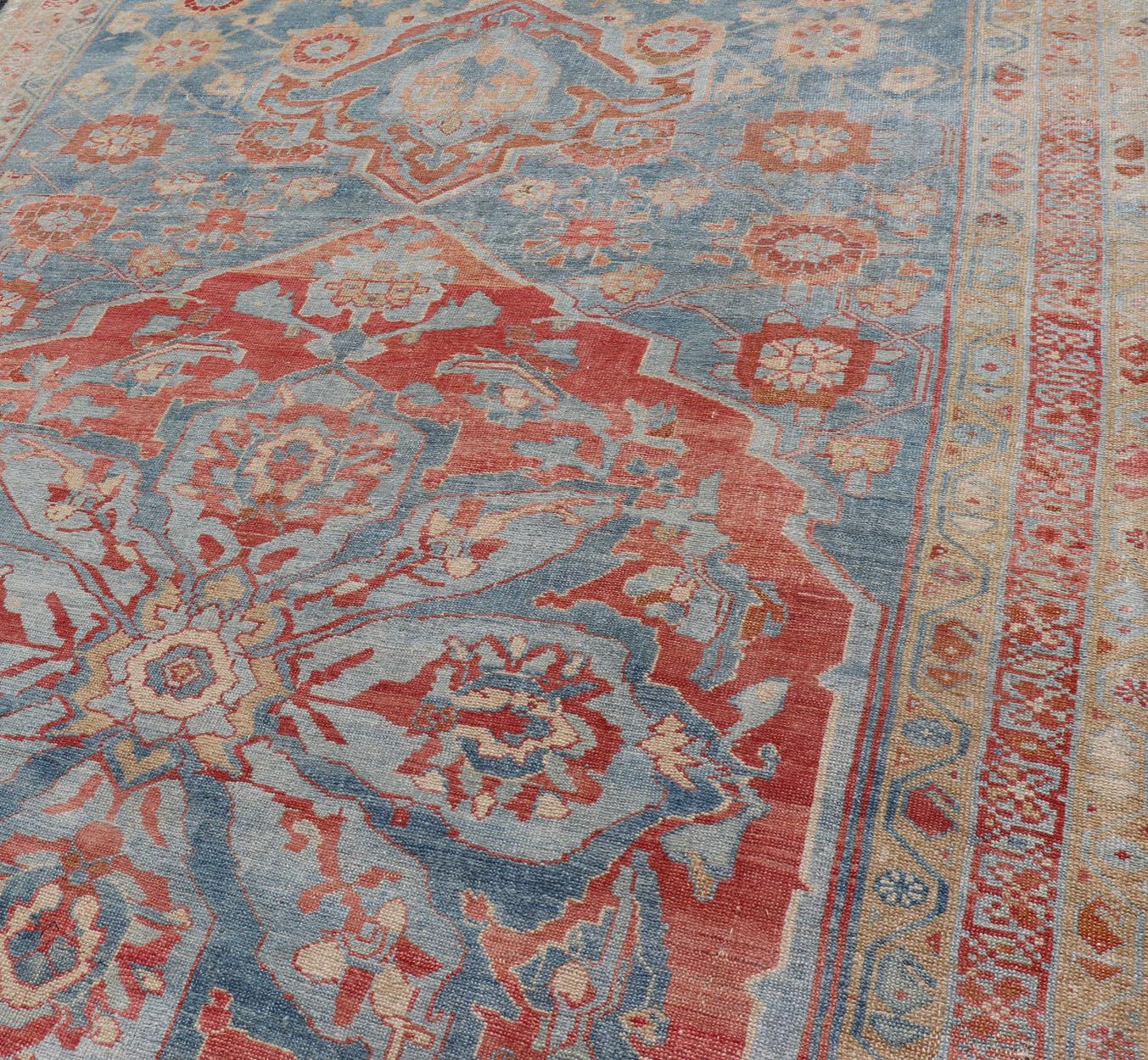 This fine antique tribal Persian Veramin rug features a floral design accentuated by a large medallion design at its center. Enclosed within a complementary, multi-tiered border, and rendered in blue, red, orange, cream and ivory tones; this rug is