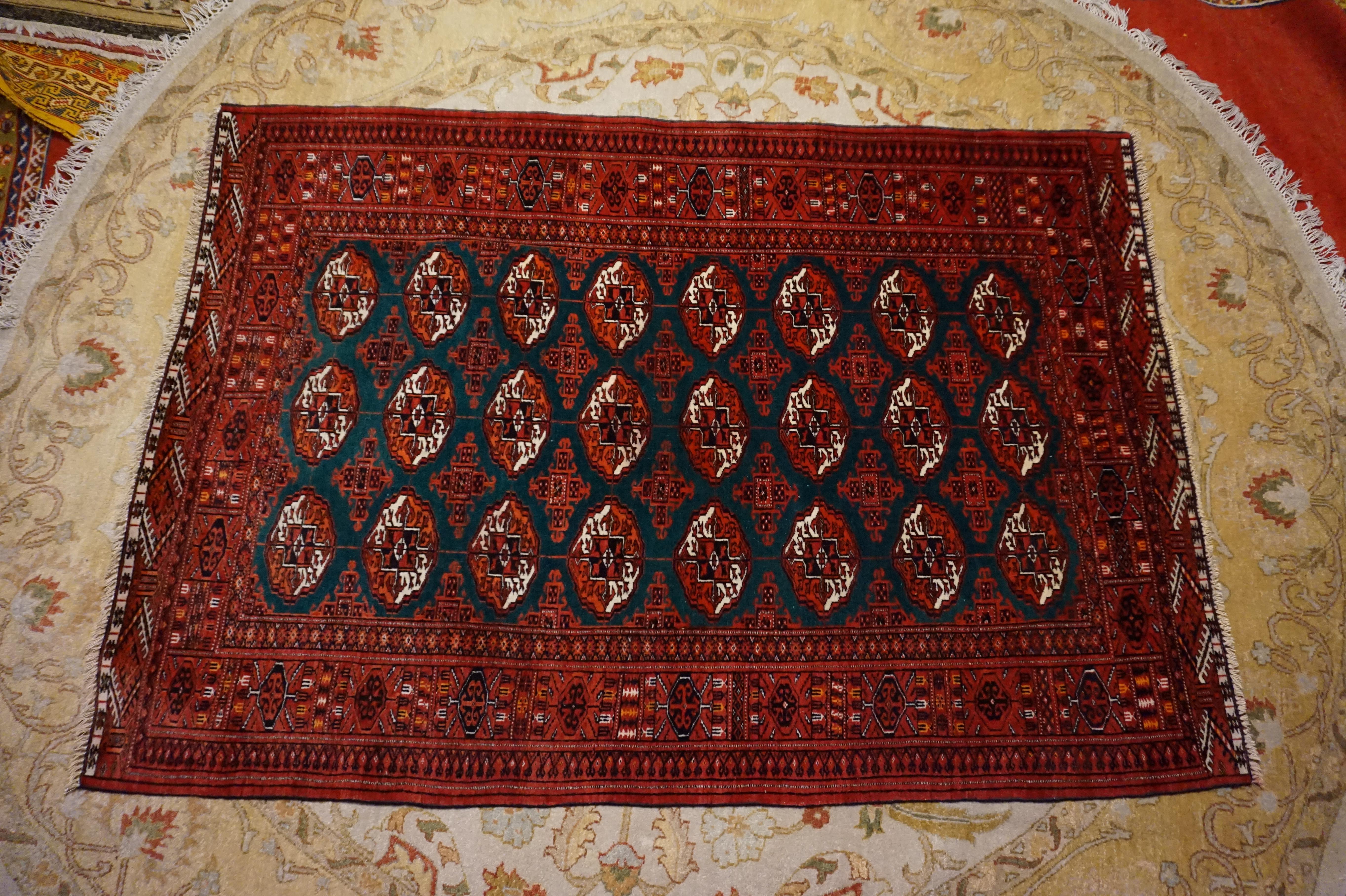 Supple, finely knotted Bokhara rug in excellent condition. The wool and pile are well preserved. The dark green background is uncommon. Crisp pattern unlike a lot of modern day renditions. Tassels in good order. Will stun.