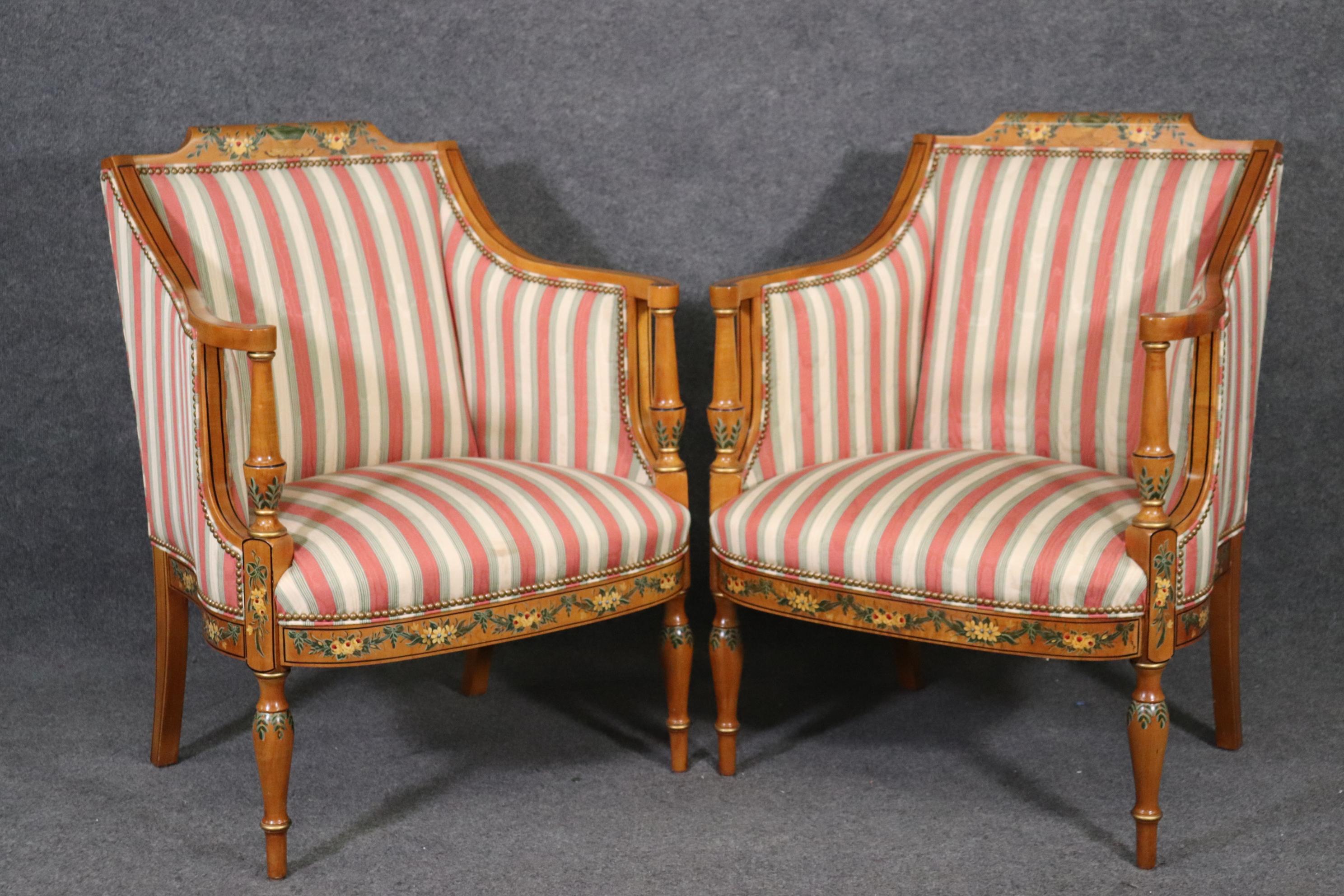 This is a gorgeous pair of English made satinwood Adams style bergere chairs. They are in good condition with very minor signs of any wear. There is a matched settee listed seperately. The chairs measure 26 deep x 37 tall x 28 wide x 17 inch seat