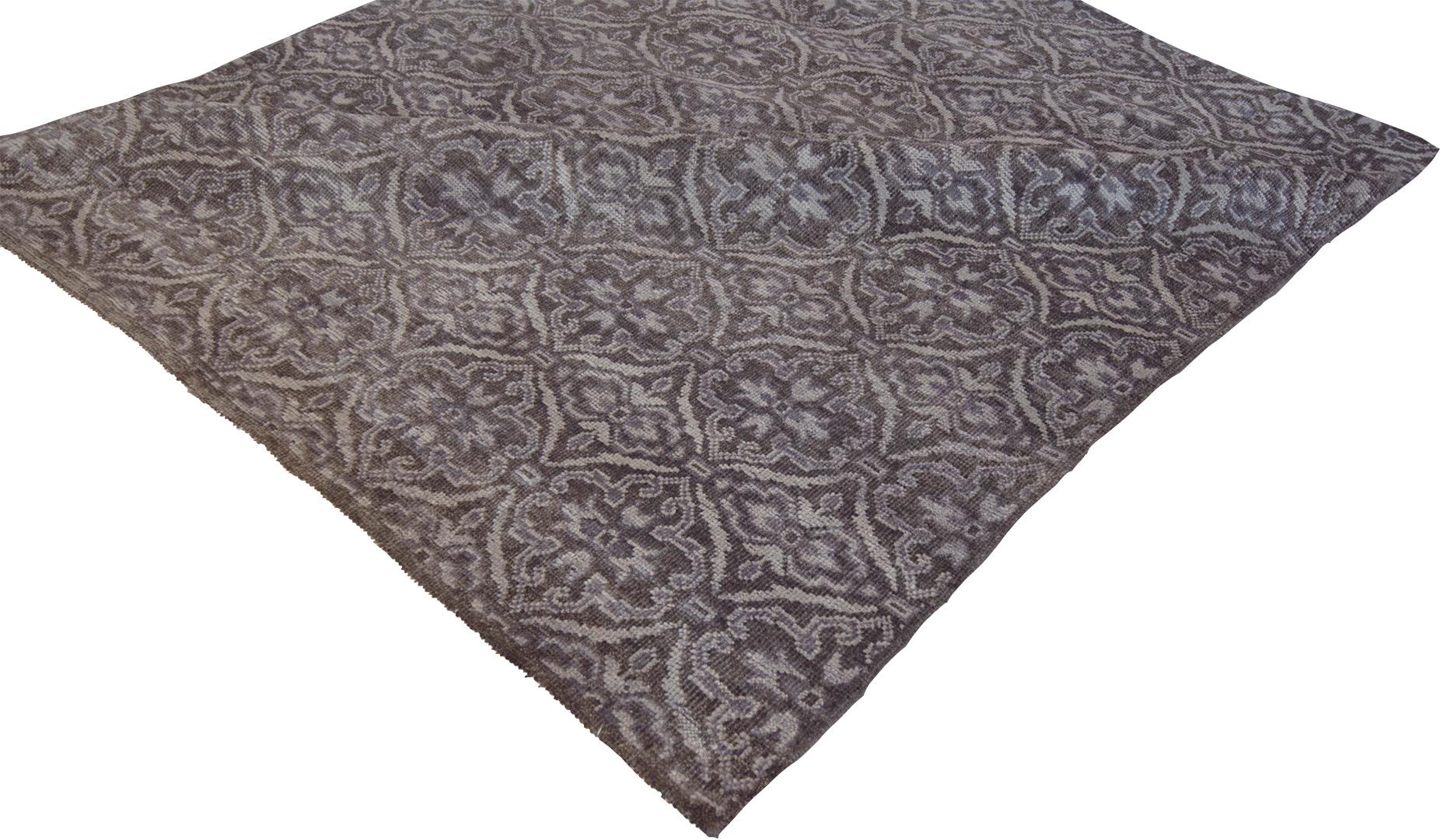 Handwoven in Kashmir, this beautiful modern rug features a soothing dark gray color field and a decorative design. 100% natural wool pile. Brand new.