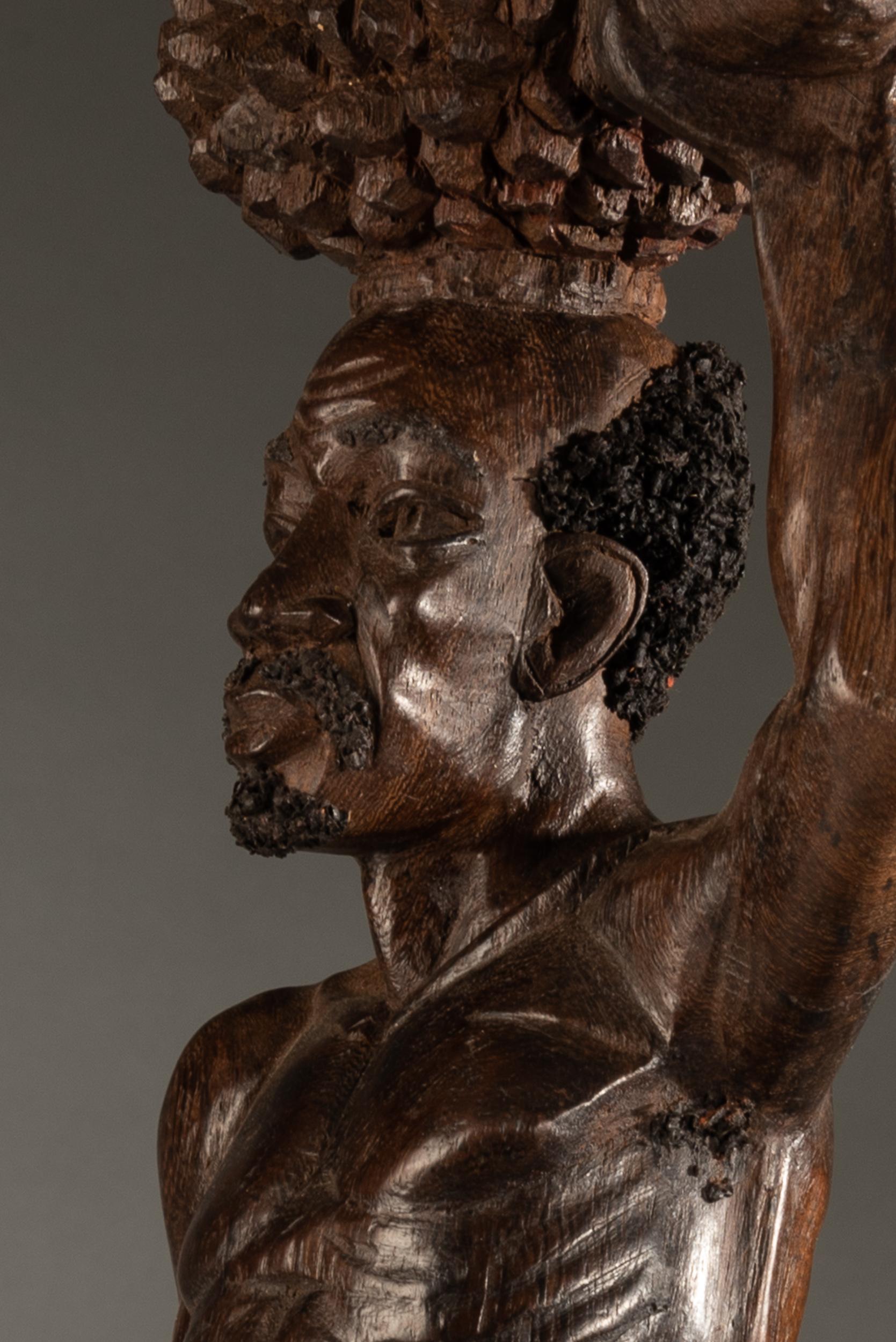 Carved Fine Hardwood Sculpture of Bearded African Man Carrying a Kalabas