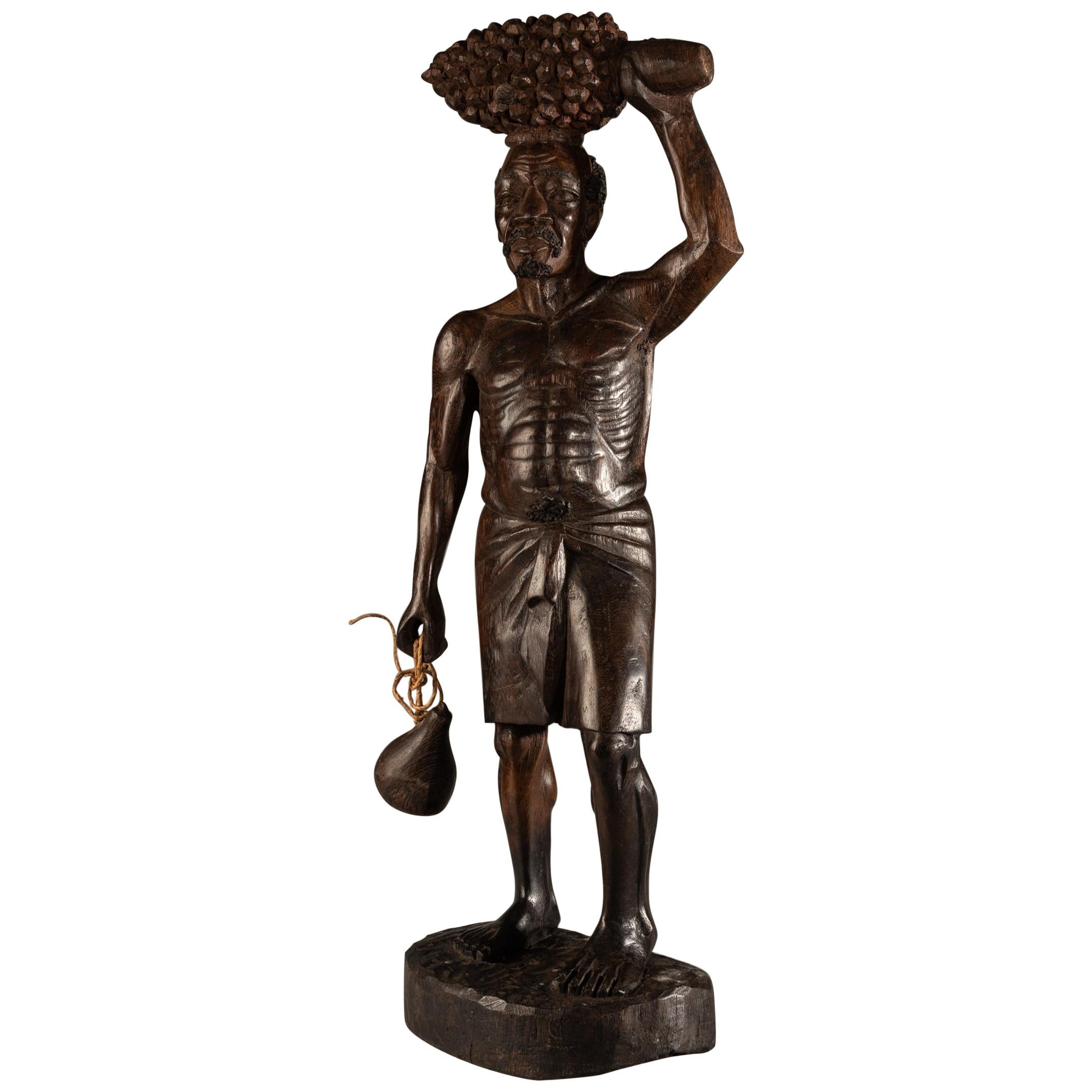 Fine Hardwood Sculpture of Bearded African Man Carrying a Kalabas