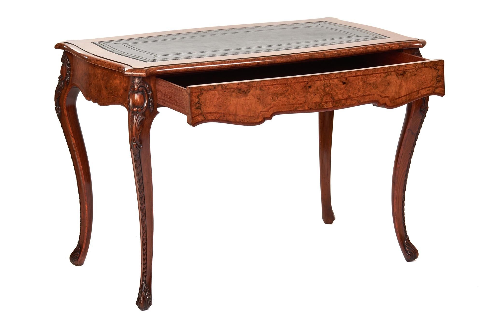 Fine Victorian Walnut Inlaid Bureau Plat / Writing table Stamped Holland & Sons
Circa 1870s
Walnut shaped top, with thumb mould edge,
Leaf & Floral inlay around top, 
Black leather inset writing surface with gilt tooling decoration. 
Walnut veneer
