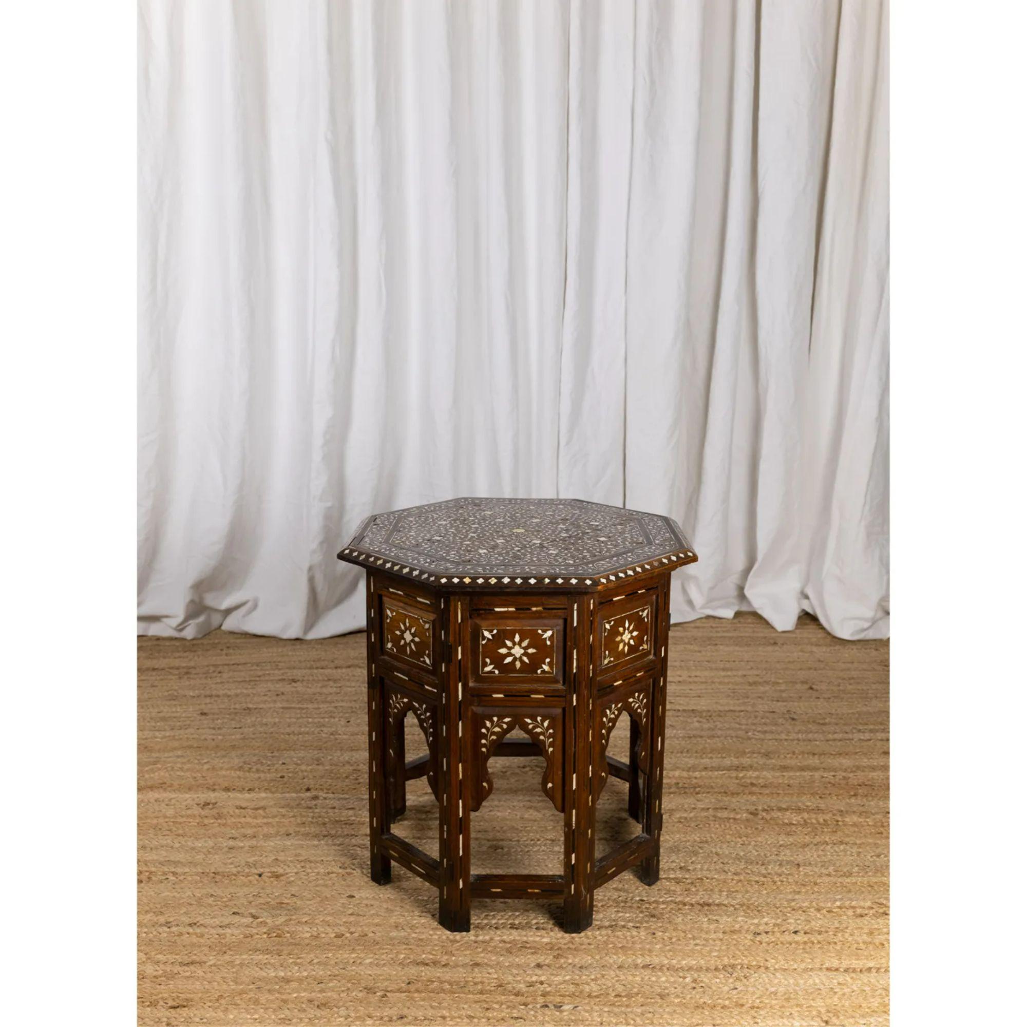 Fine Hoshiarpur octagonal table, 19th Century

A 19th Century Octagonal Anglo Indian Occasional Table Inlaid with Bone and Ebony Standing on a Folding Base with Shaped Arches.

For shipping to the US please contact before purchase to discuss CITES