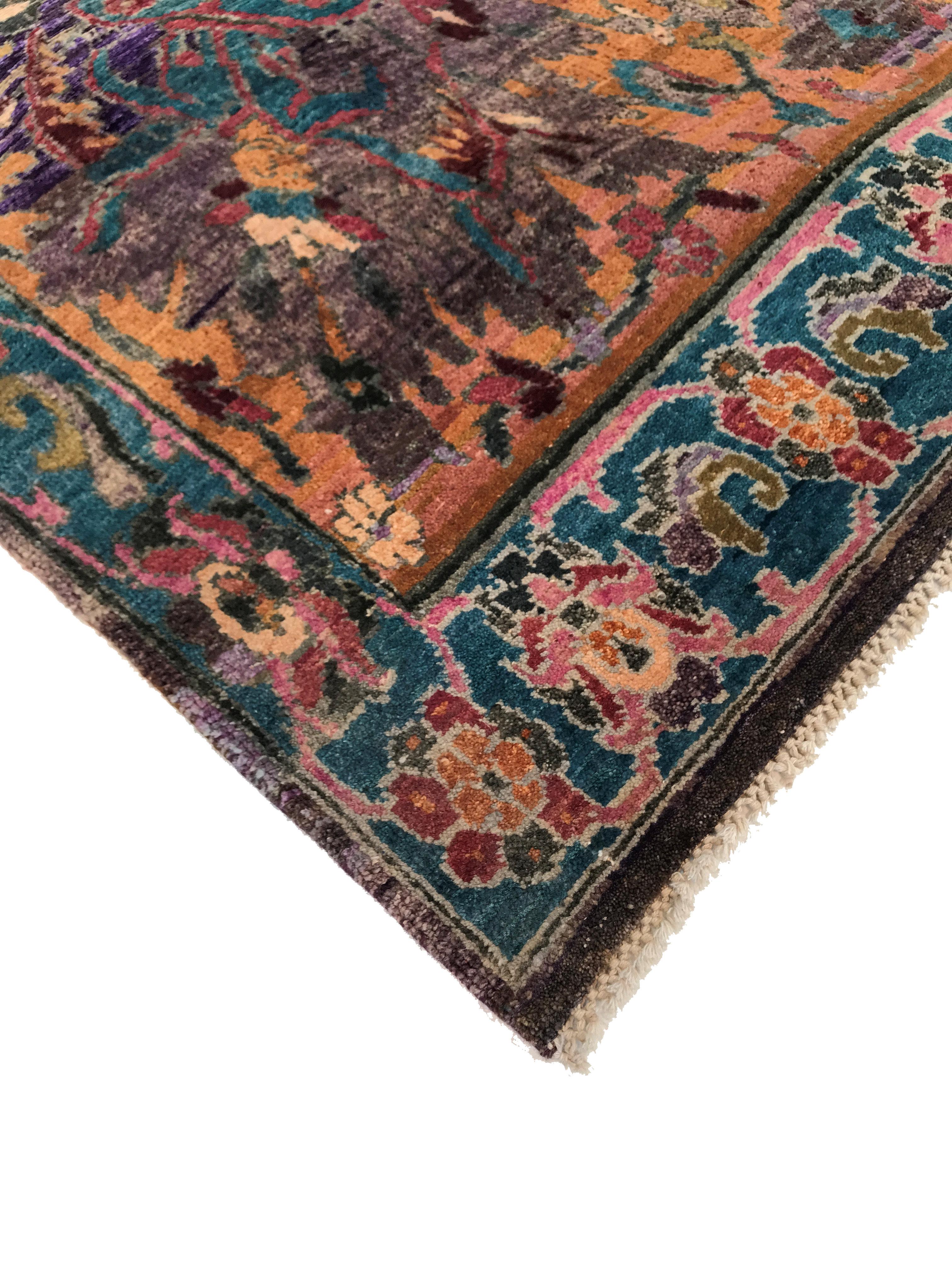 This one-of-a-kind handknotted carpet was made in India with love. With a multitude of pictorial motifs, this carpet reads like a stunning ancient tapestry. Delightful scenes of yogis in meditation or a Mughal King riding an elephant meet primal