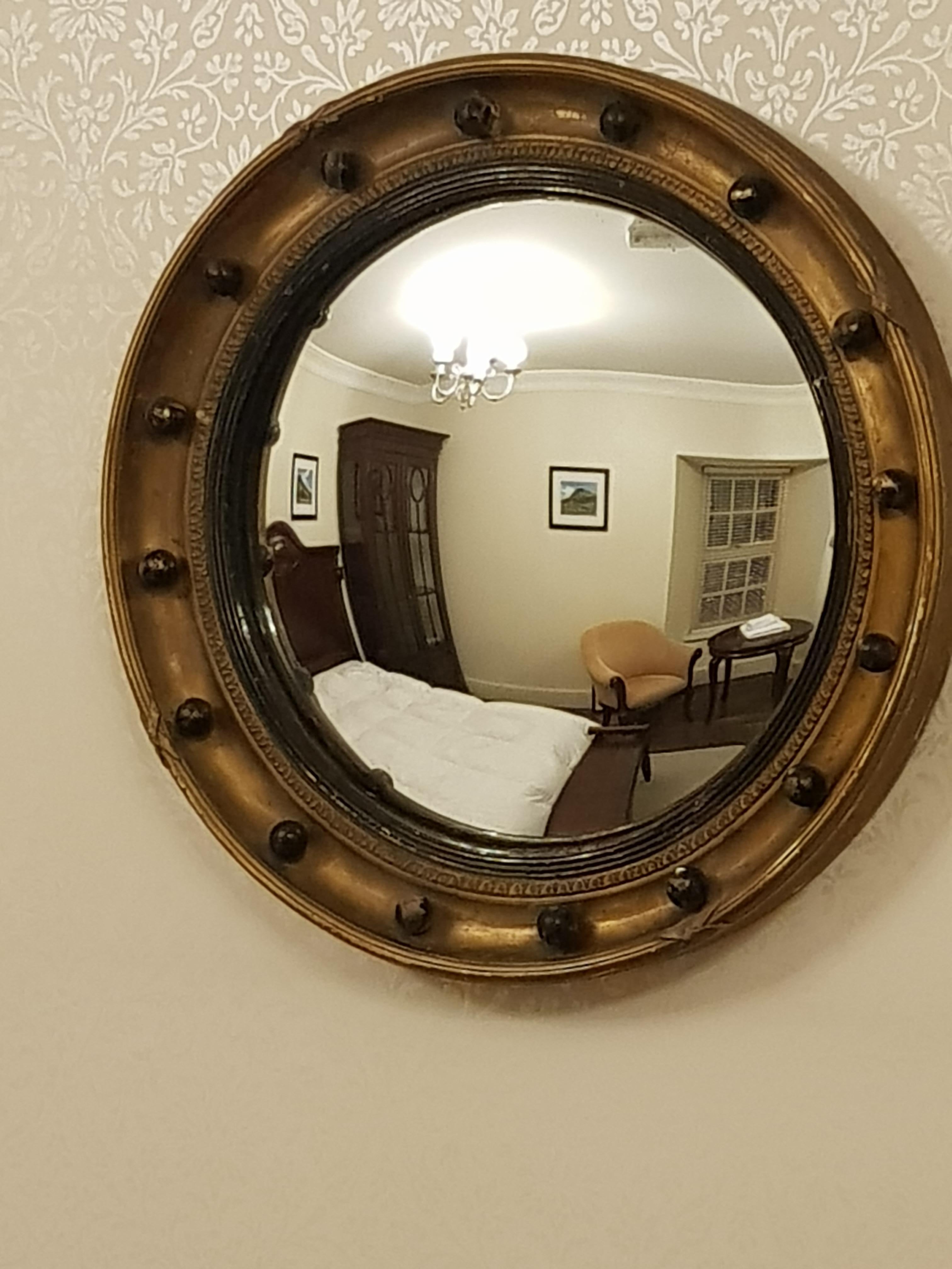 Fine Irish 19th century gilt convex mirror with original patina.