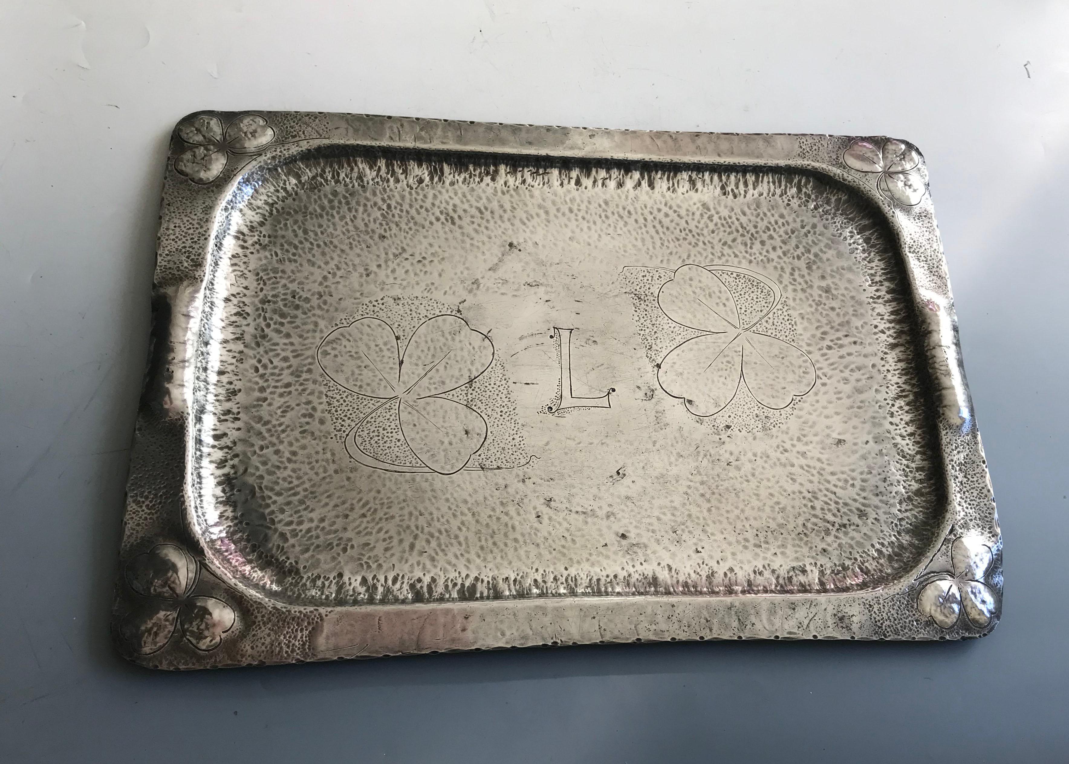 Irish Arts & crafts Folk Art Pewter Shamrock design tray
A Fine Irish Arts and crafts serving tray with hammered and chased 
shamrock designs 
Rare One of a kind piece
Period 1930`s A scarce piece : Maker Unknown
Condition Fine
Size 20 x 14 inches