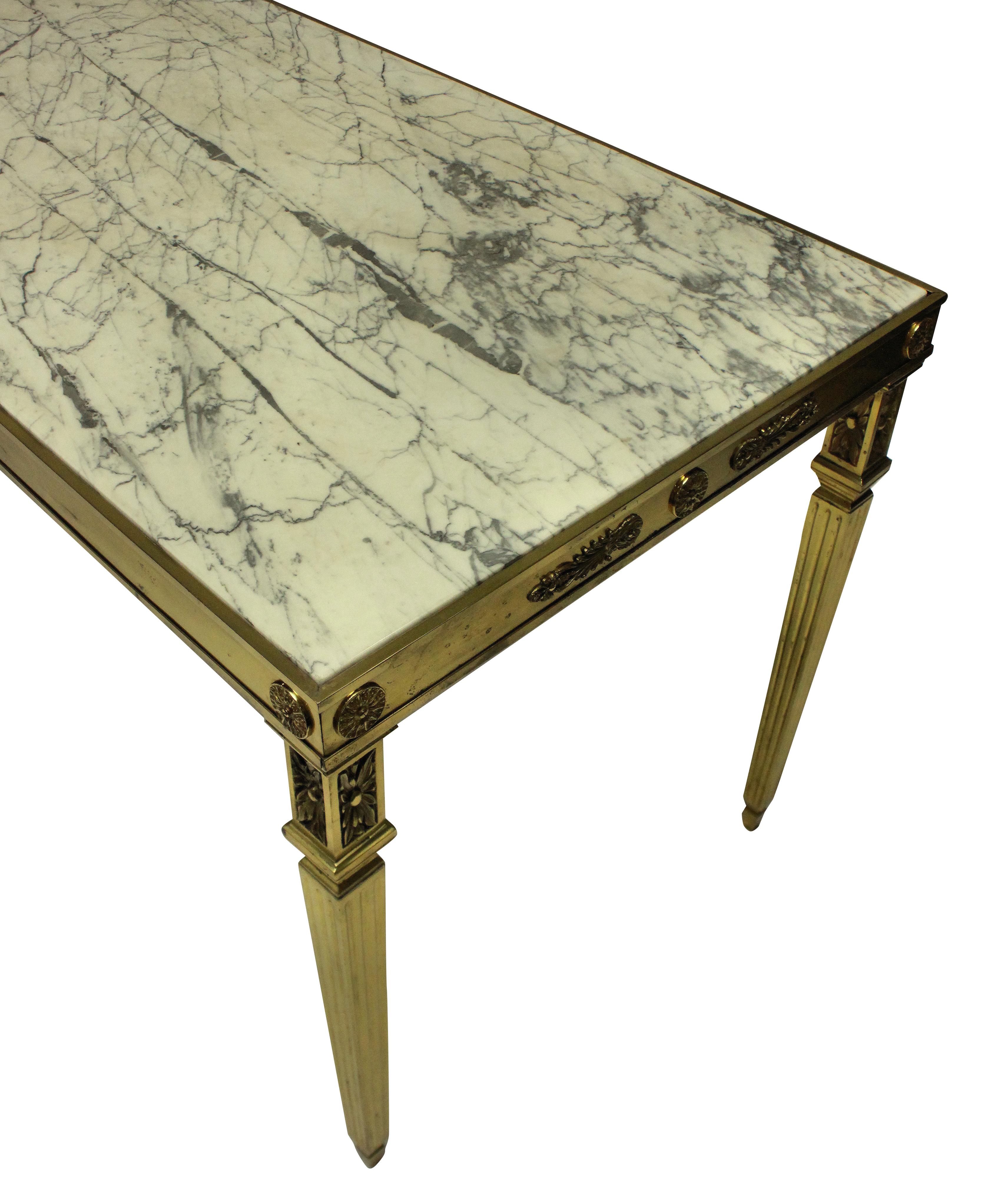 A fine Italian gilt bronze neoclassical hall table, with acanthus decoration around each frieze and on square tapering fluted legs. With an inset grey and off white marble top.