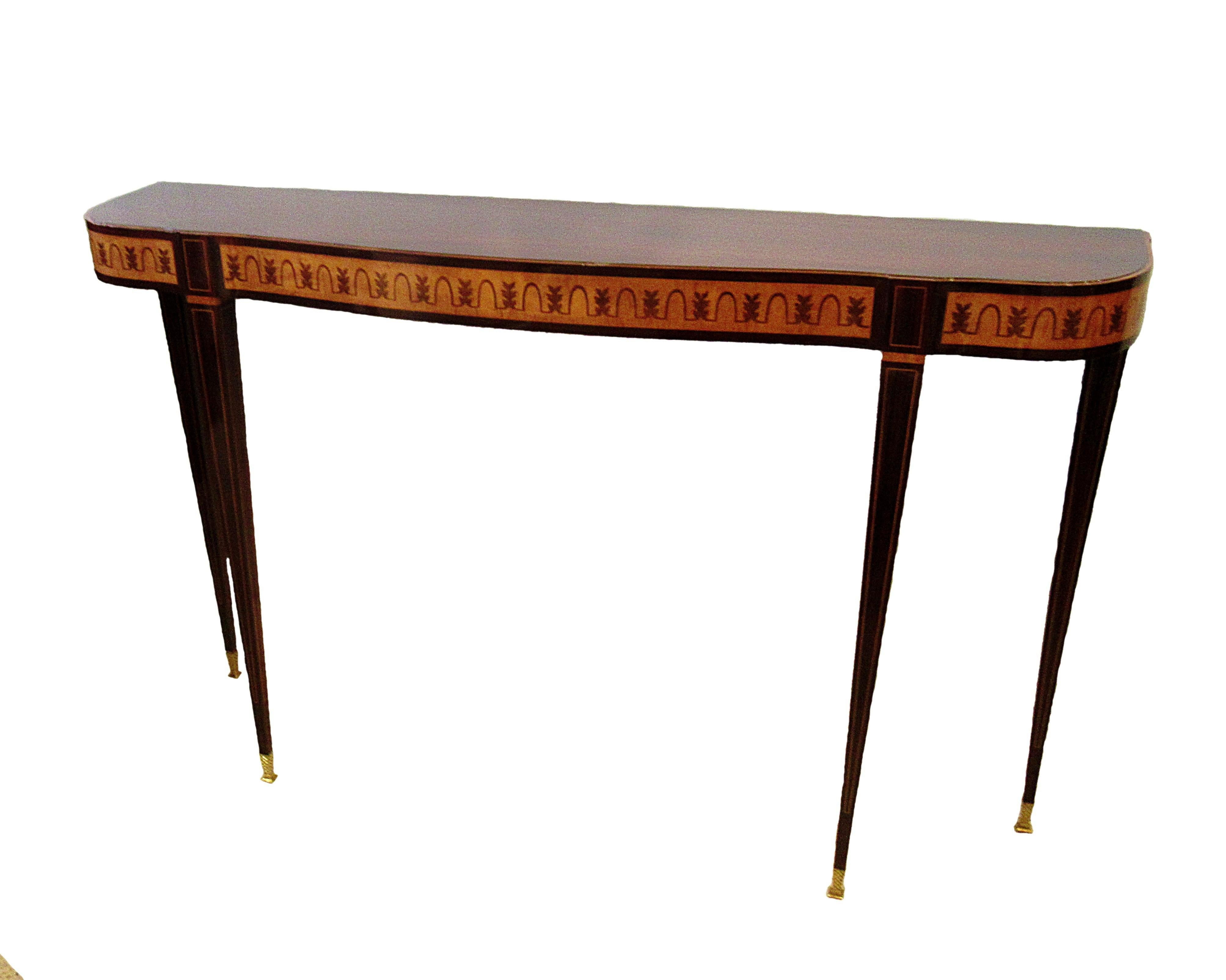 Fine Italian modern parquetry console table, the rosewood top above a frieze inlaid with rosewood and walnut classical motif on square tapering legs with band inlay, terminating with sabots. This is classic Paolo buffa, incorporating 18th century