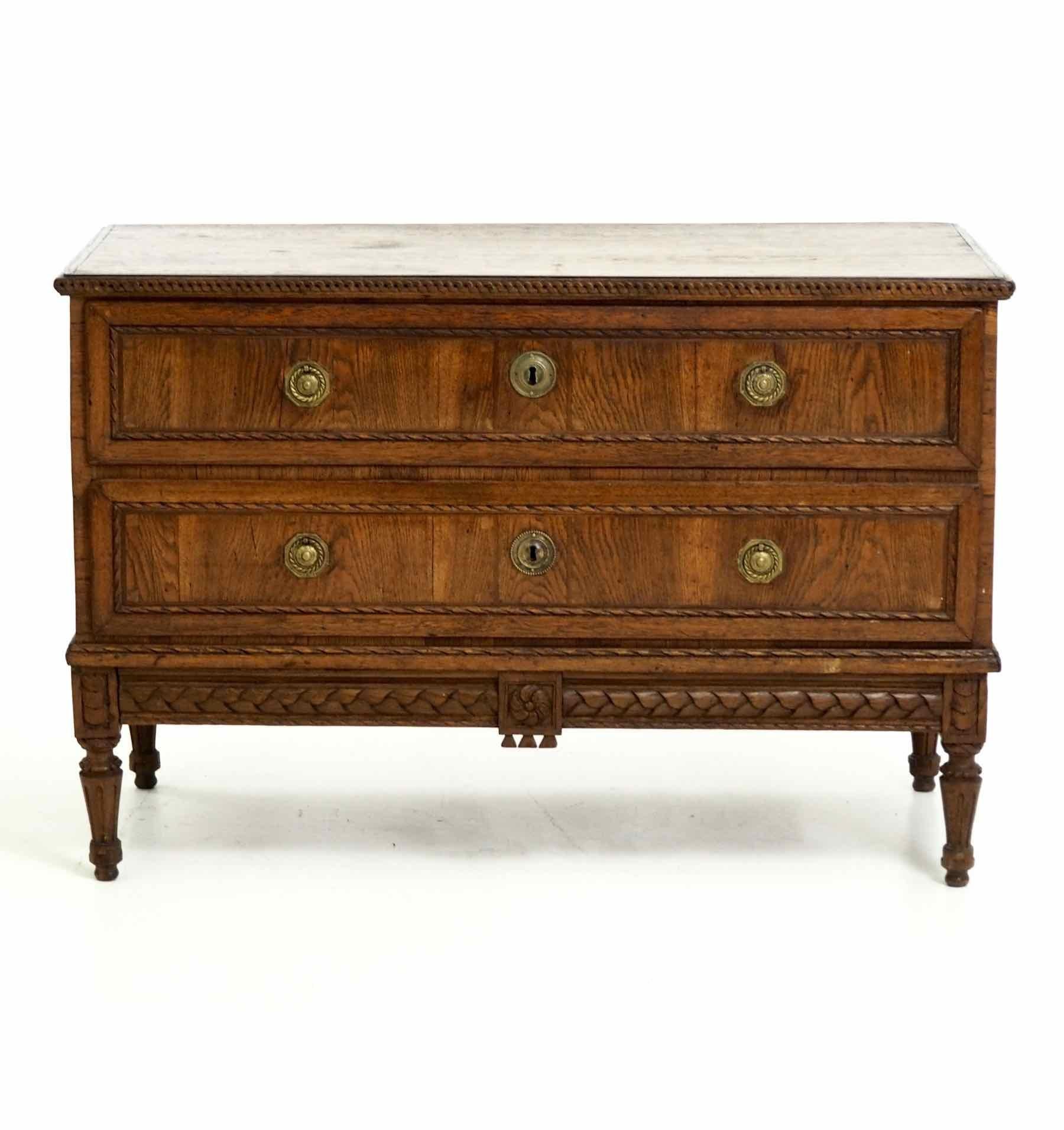 Stunning and rare Italian or French Louis Seize chest in fruitwood, with two drawers, richly carved. Original locks and patina, from the 1790s. 

 Measures: H. 84, W. 127, D. 63 cm
 H. 33, W. 50, D. 24.8 in.