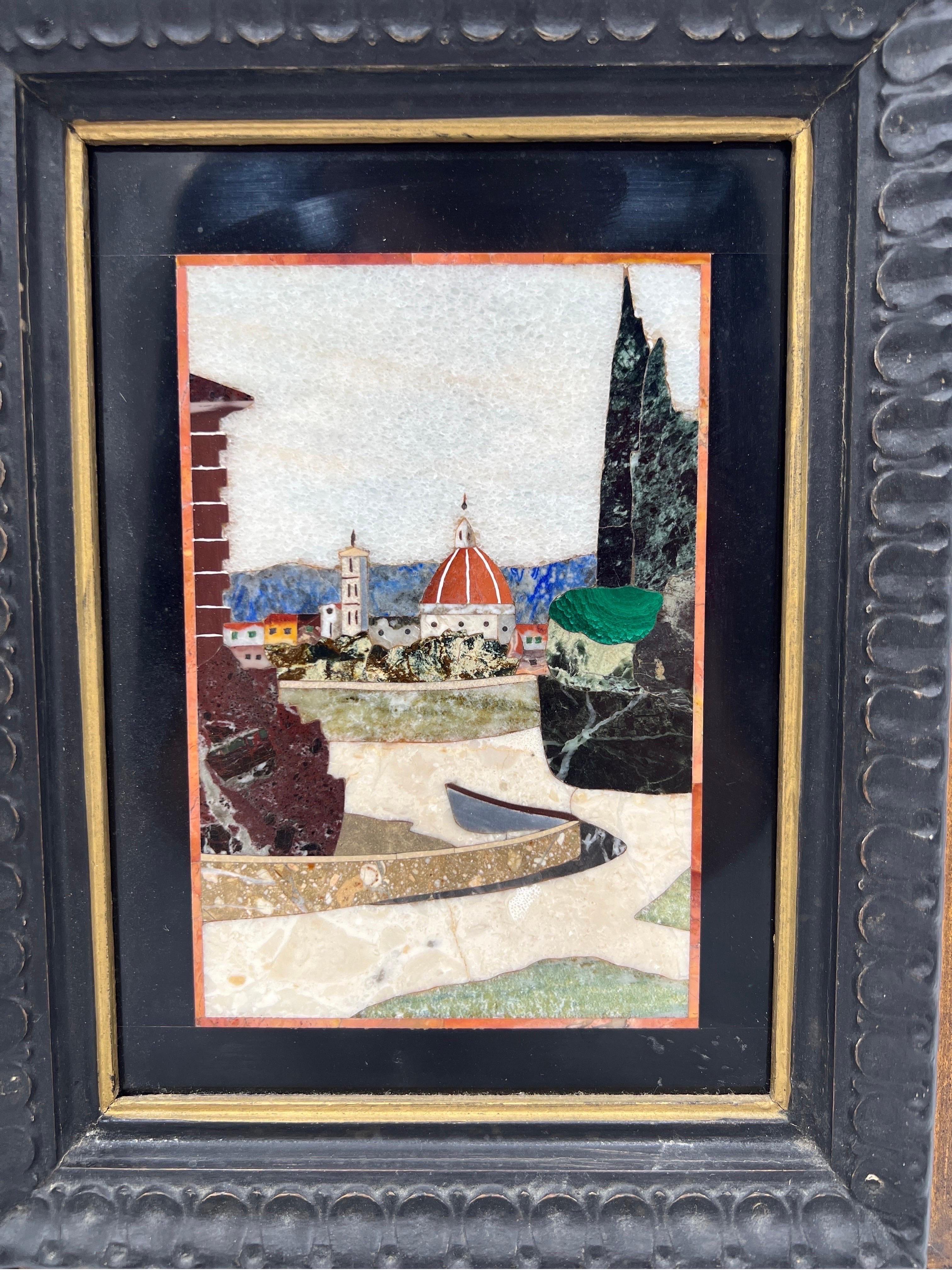 Crafted of fine quality Italian inlaid natural stone such as jasper malachite and agate. Depicts an Italian village landscape scene with different building structures.