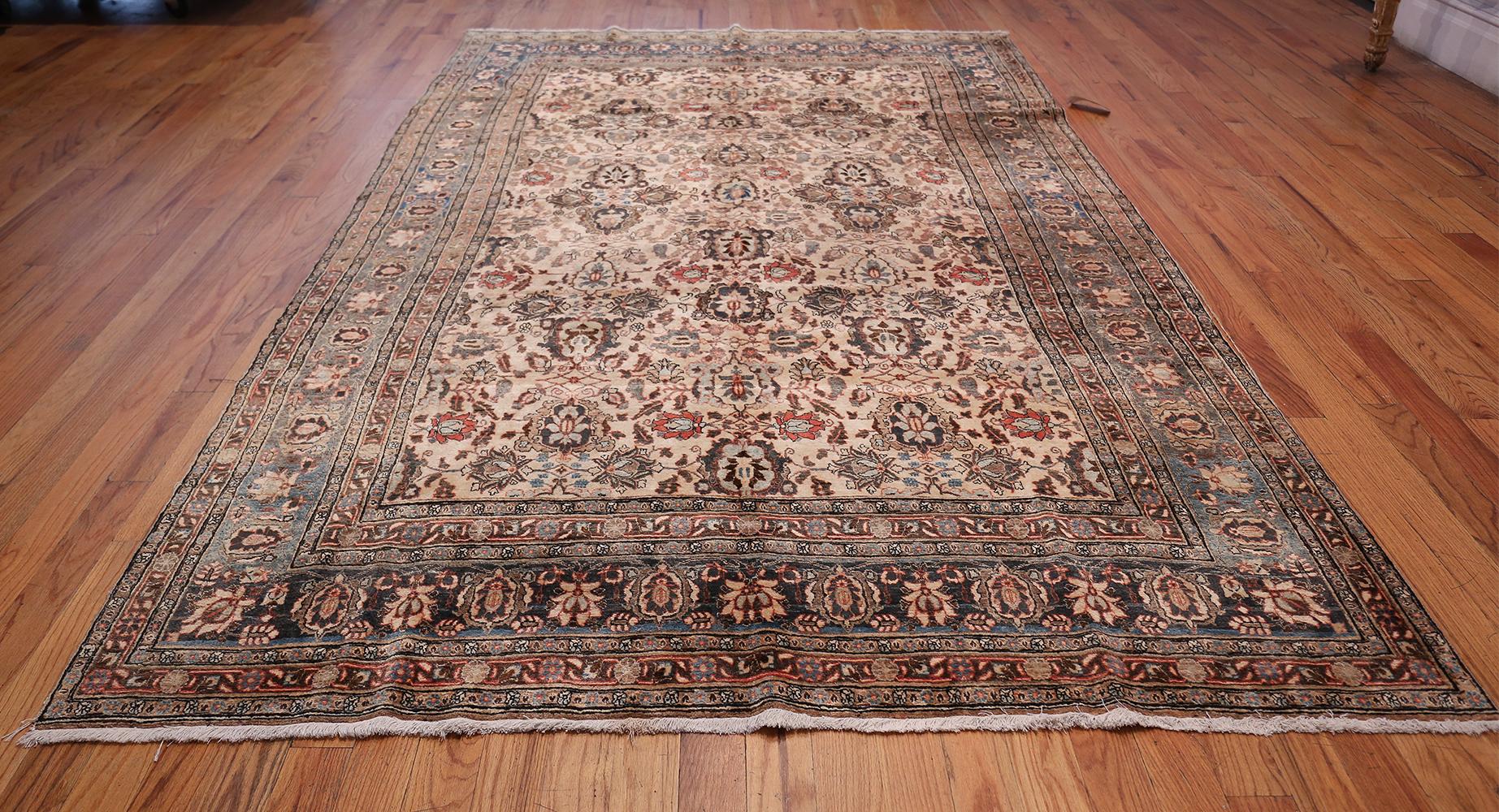 Finely woven ivory background colored antique Persian Tabriz rug, country of origin: Persia, circa early 20th century. Size: 6 ft 5 in x 10 ft 5 in (1.96 m x 3.17 m)

A cultural center and capital of the northwestern Iranian province of Azerbaijan,