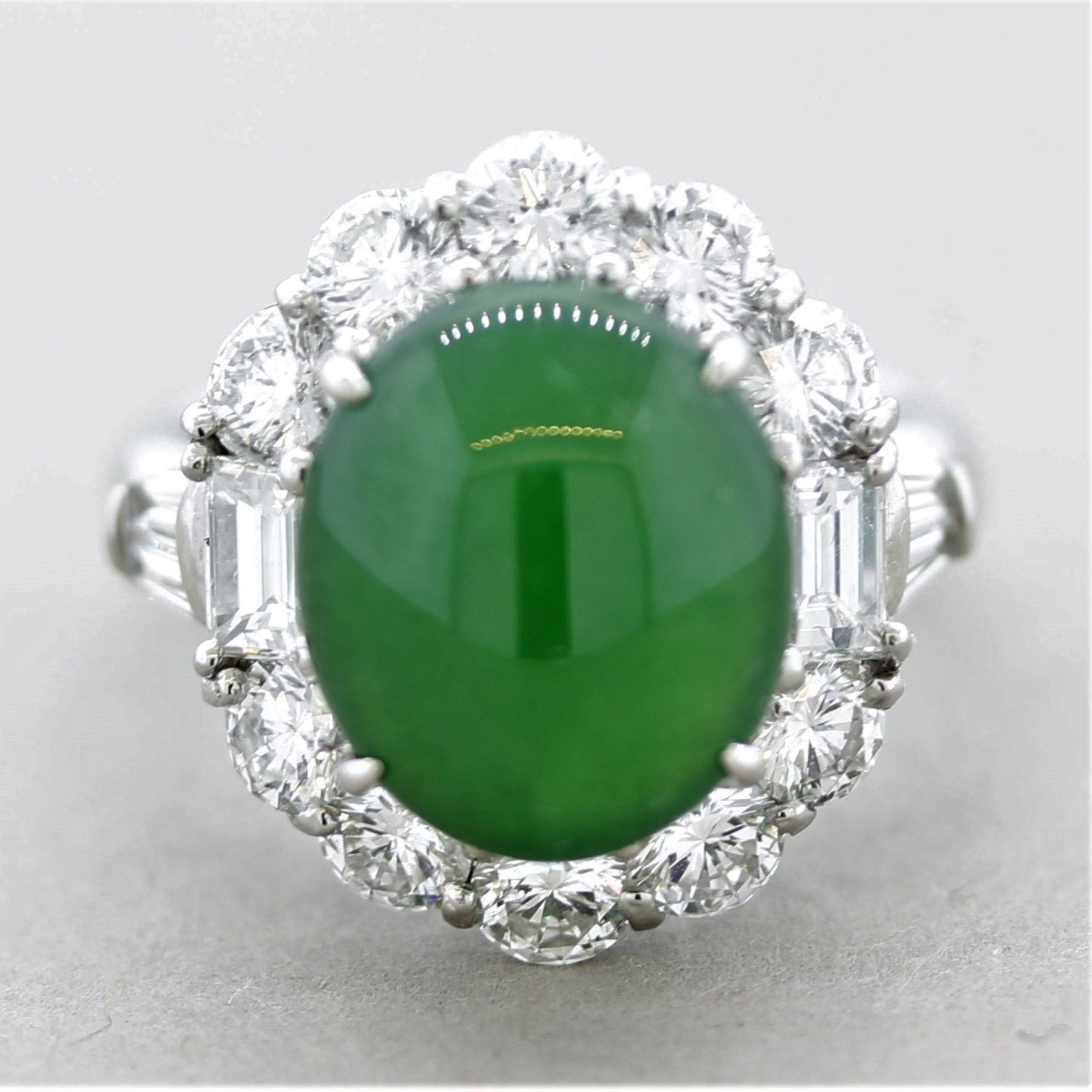 A superb natural jadeite jade weighing 5.34 carats takes center stage! It has the ideal evenly colored grass green color and strong luster. It is certified by the GIA as Type A (no treatments). The fine jade is accented by 2.20 carats of large