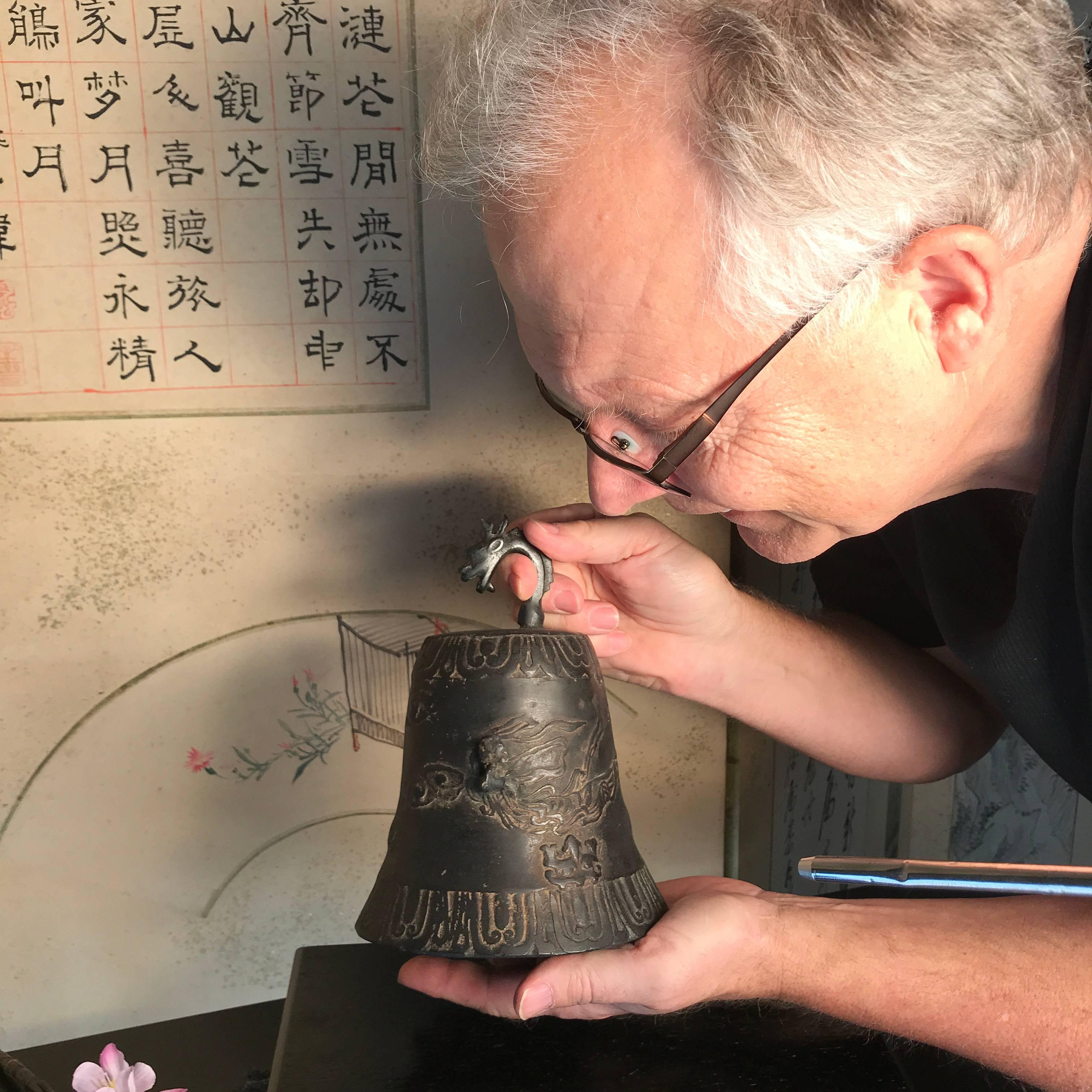 An unusual find from Kyoto during our recent acquisitions trip to Japan.

This superbly caste antique bronze fire bell size form came out of an old Kyoto collection. The unusual oval shaped base combined with It's dramatic surface 
