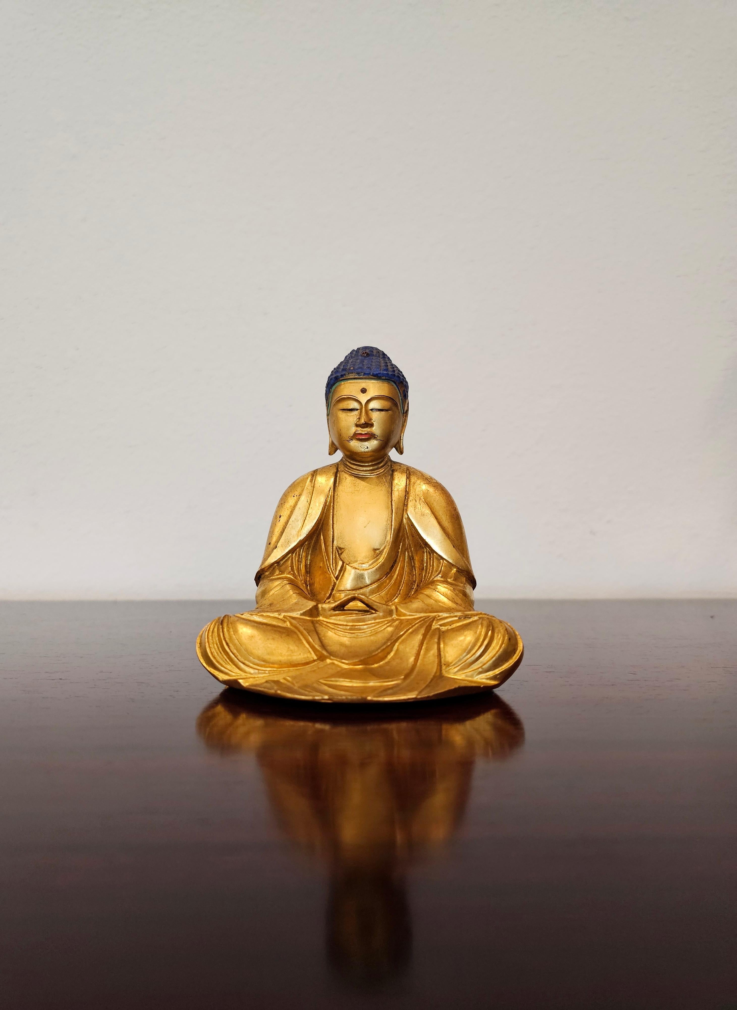 A remarkable very fine quality late Edo Period (1603-1868) Japanese hand carved and painted gemstone mounted lacquered gilt wood Buddha figure. 

Japan, circa 1860, exceptionally carved diminutive lightweight wooden Buddha sculpture, with blue domed